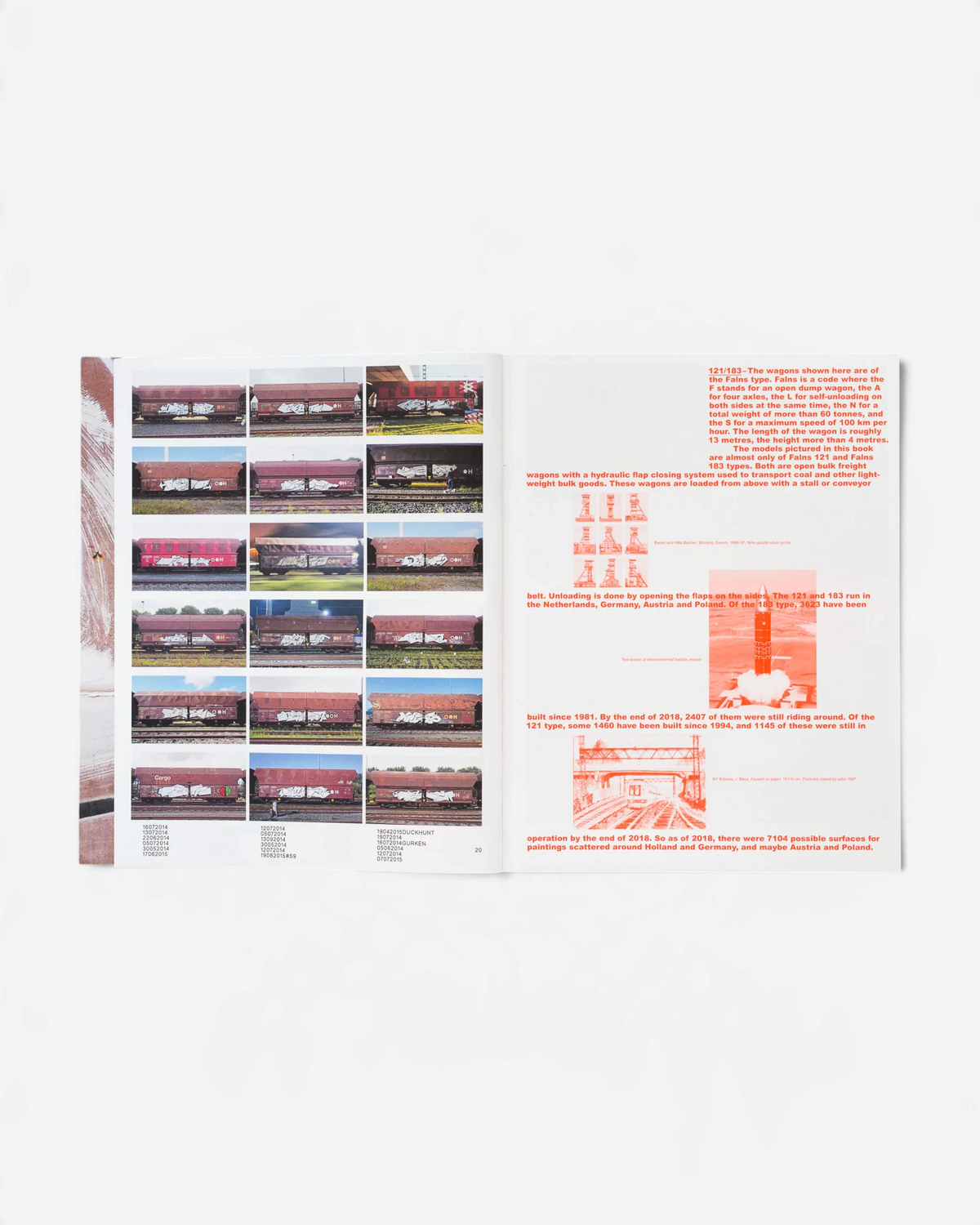 Astrofat 121/183 book open to a page showing a grid of graffiti-painted red-brown freight train wagons and text.