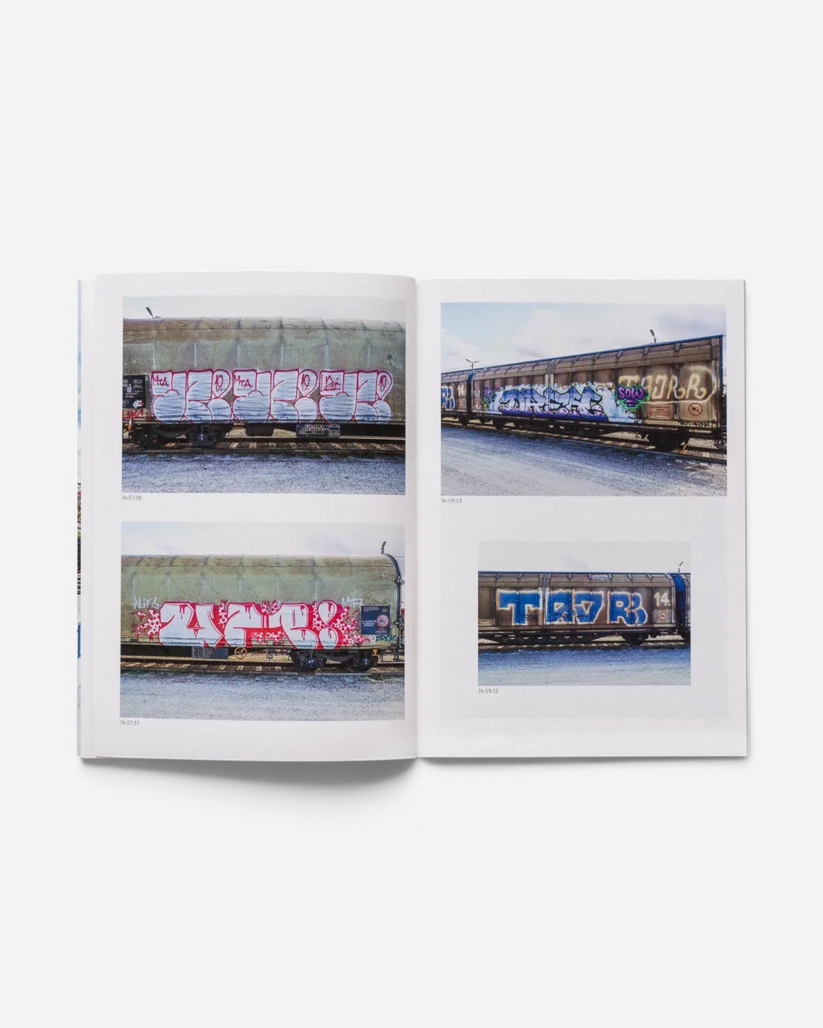 Astrofat 136 Minutes of Malmö zine showing freight train graffiti photography with timestamps on white pages