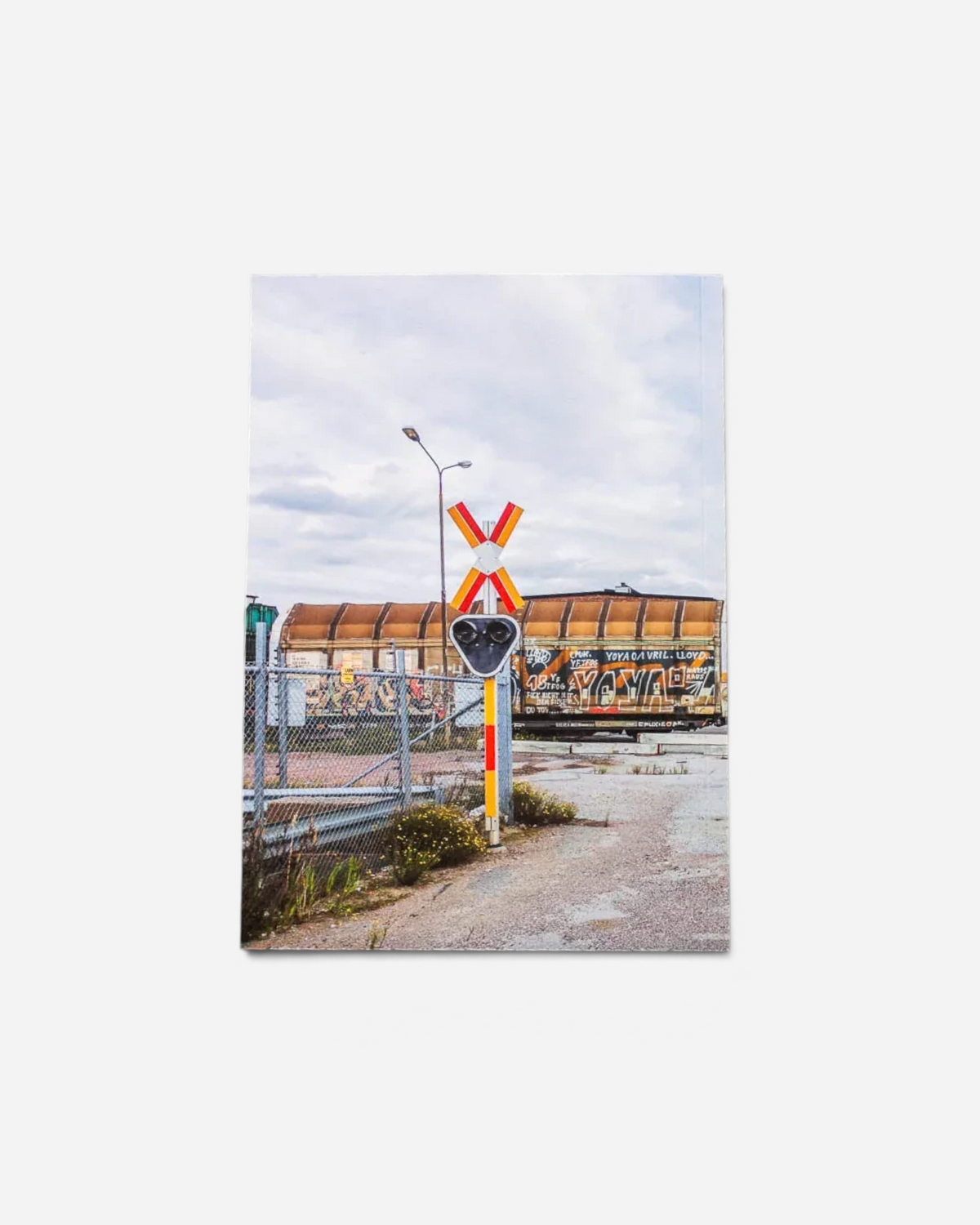 Astrofat 136 Minutes of Malmö zine featuring a freight train with graffiti at a railway yard in Sweden