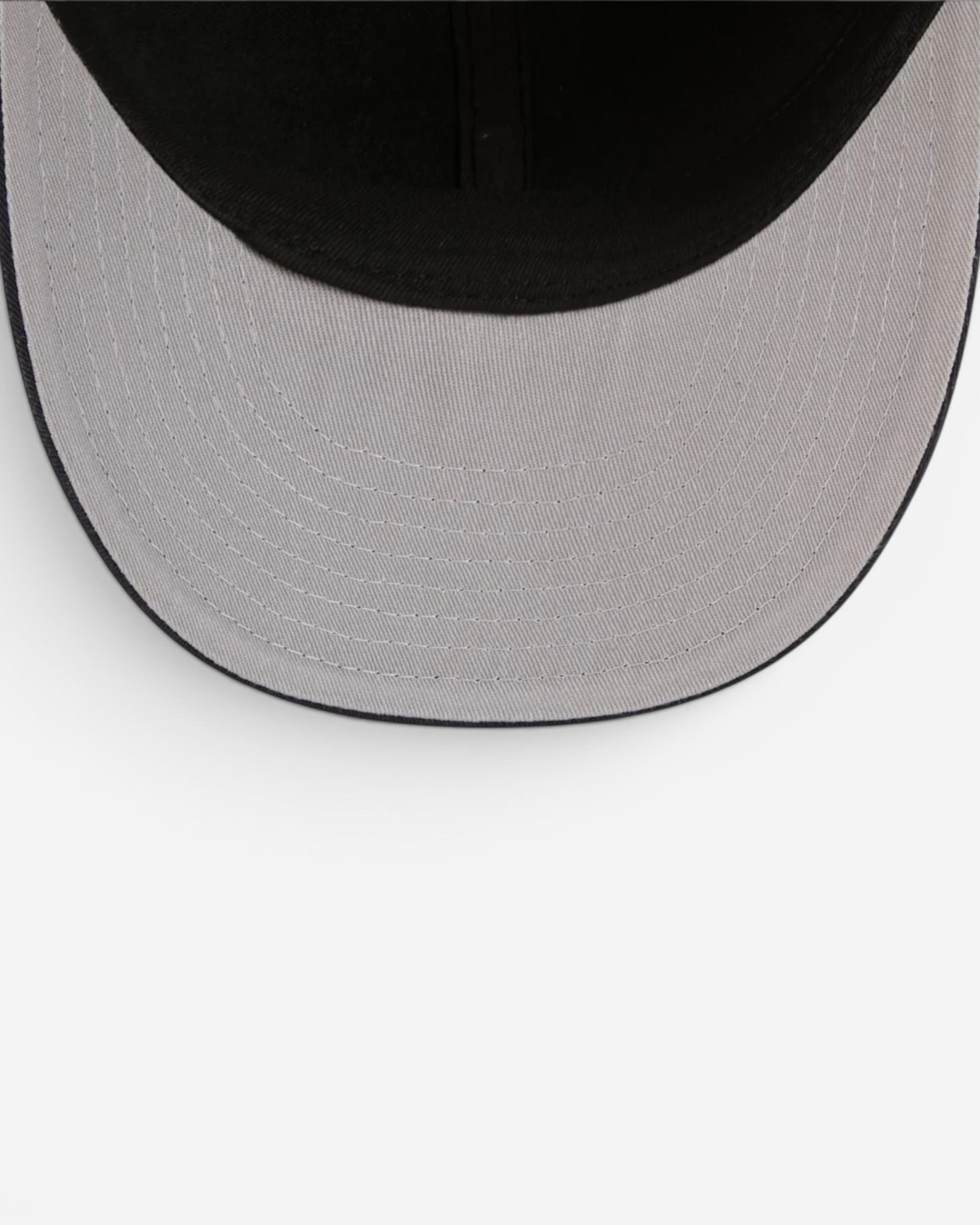 Astrofat 59FIFTY Low Profile Metallic Badge Black fitted cap, showing the underside of the brim and interior.