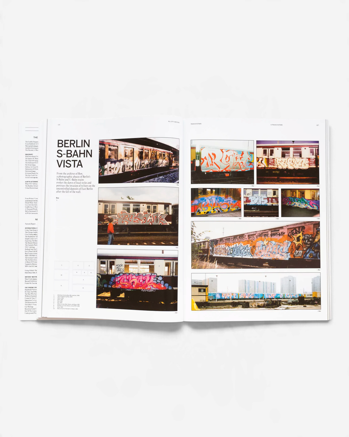 Astrofat All City Writers Edition X book open to pages showing graffiti on Berlin S-Bahn trains and detailed text.