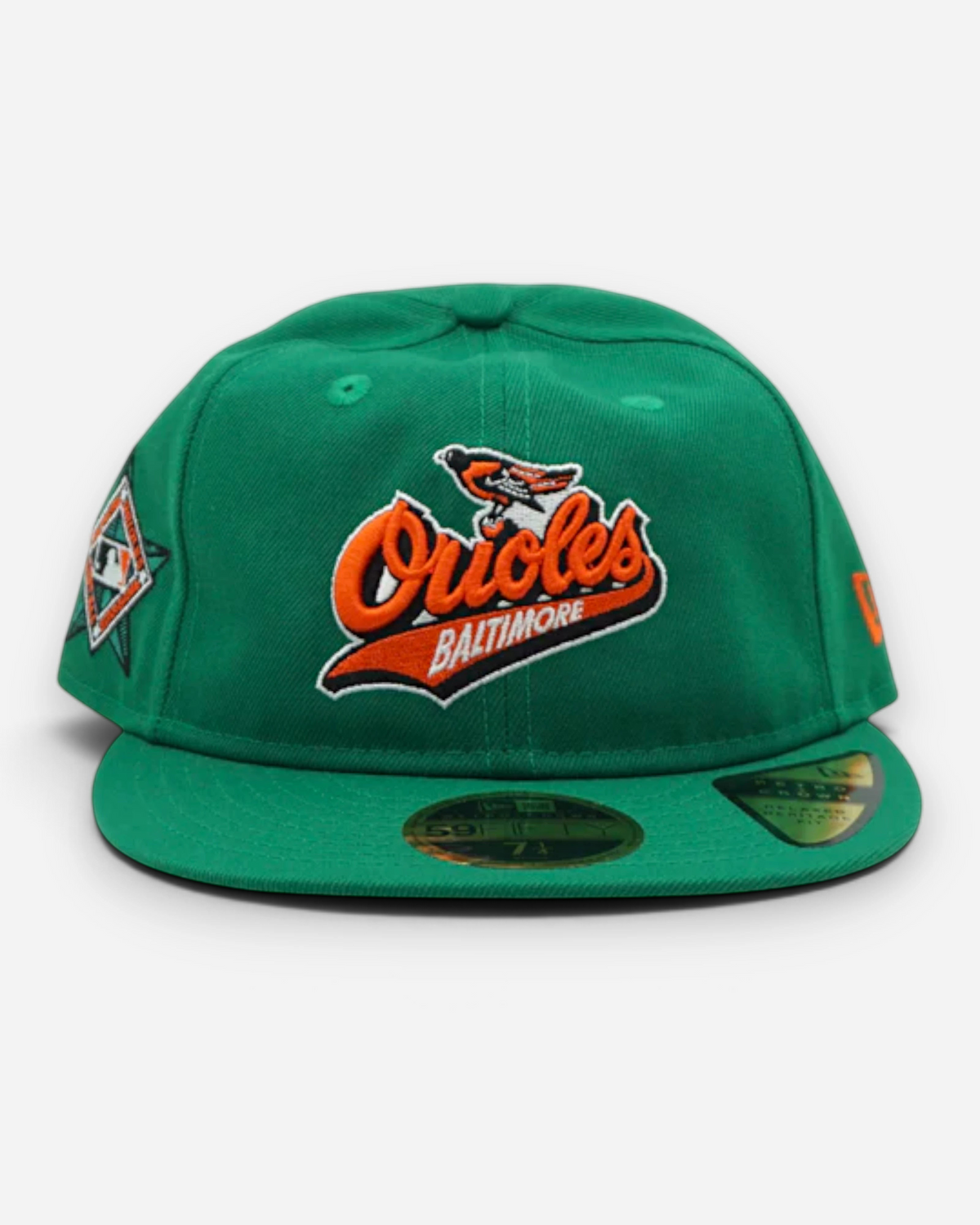 Astrofat 59FIFTY Baltimore Orioles retro crown cap in green with orange embroidery, flat visor, and side patch.