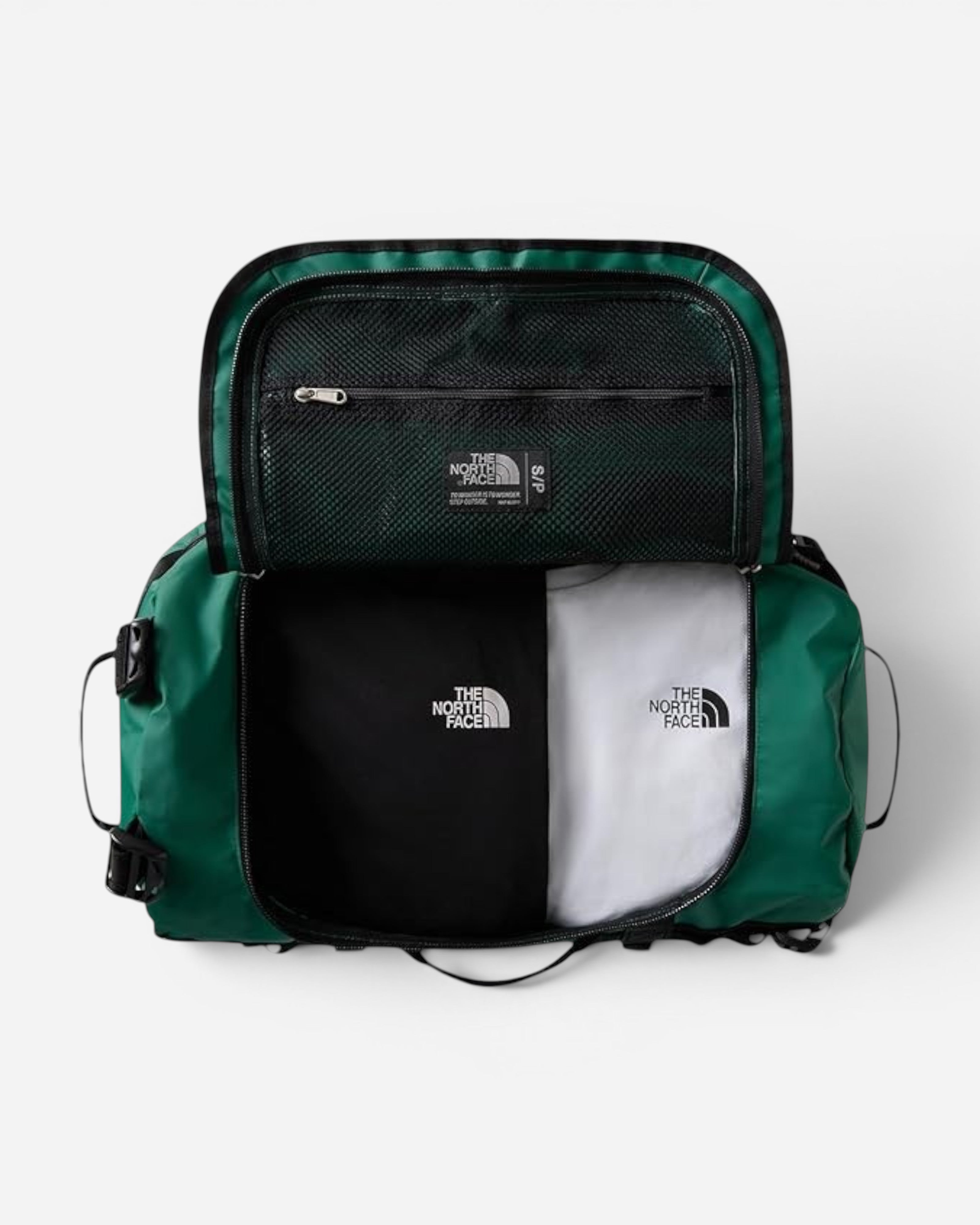 Astrofat The North Face Base Camp 50L duffel bag in evergreen, shown open with internal mesh pocket and folded shirts.