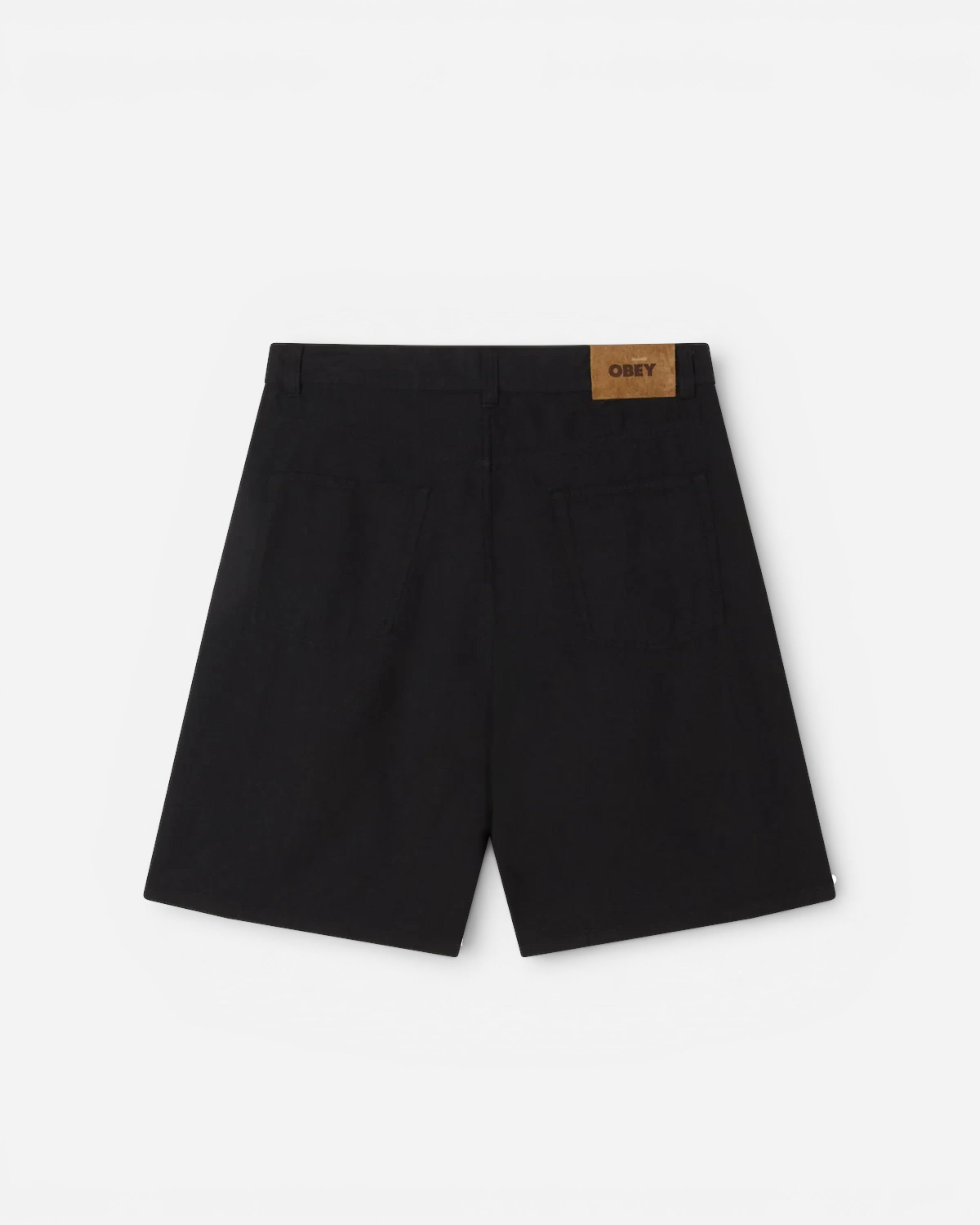 Astrofat black baggy denim shorts featuring a rear Obey logo patch and classic five-pocket design.