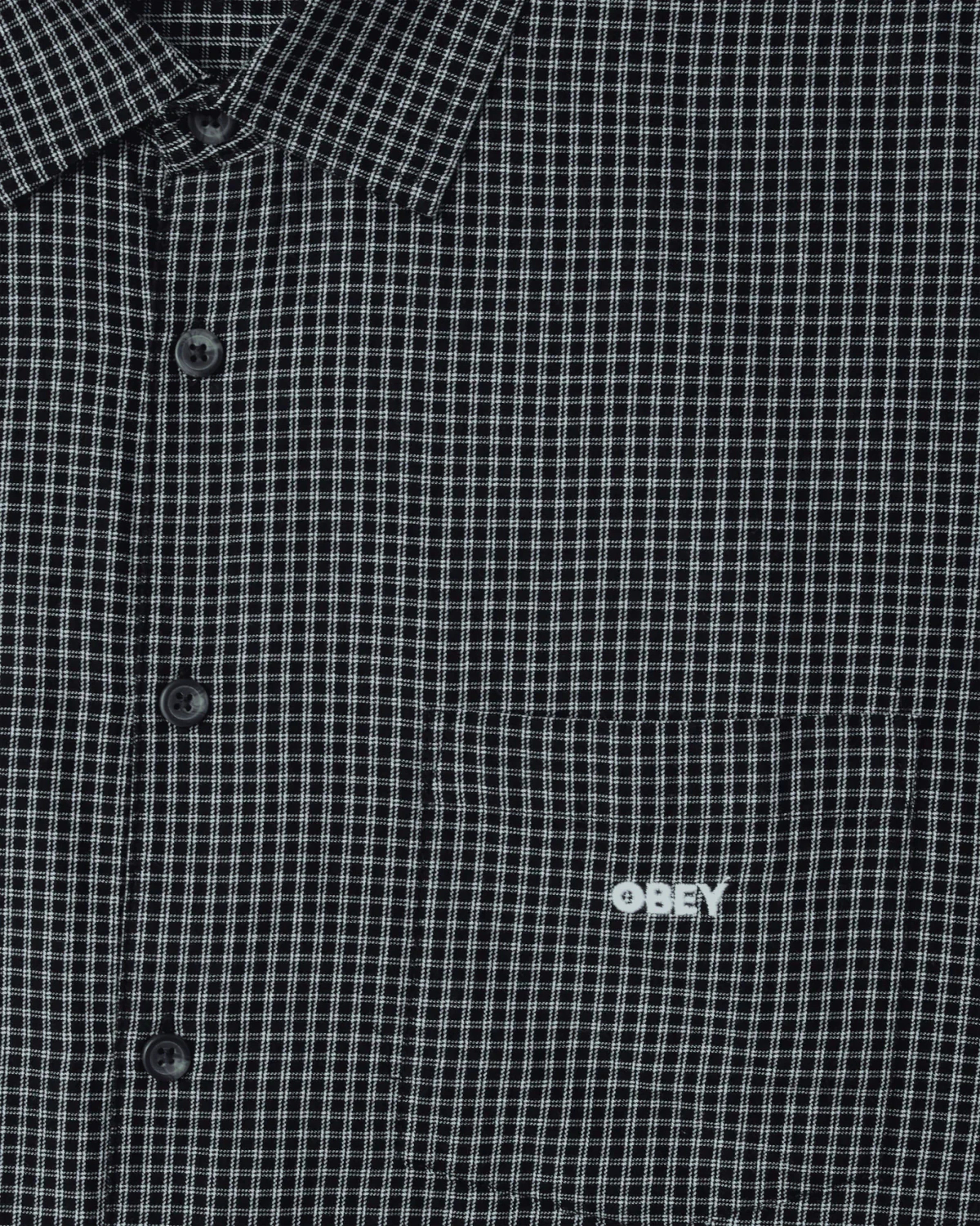 Astrofat black and white checkered short sleeve shirt with button front, chest pocket, and embroidered logo detail.