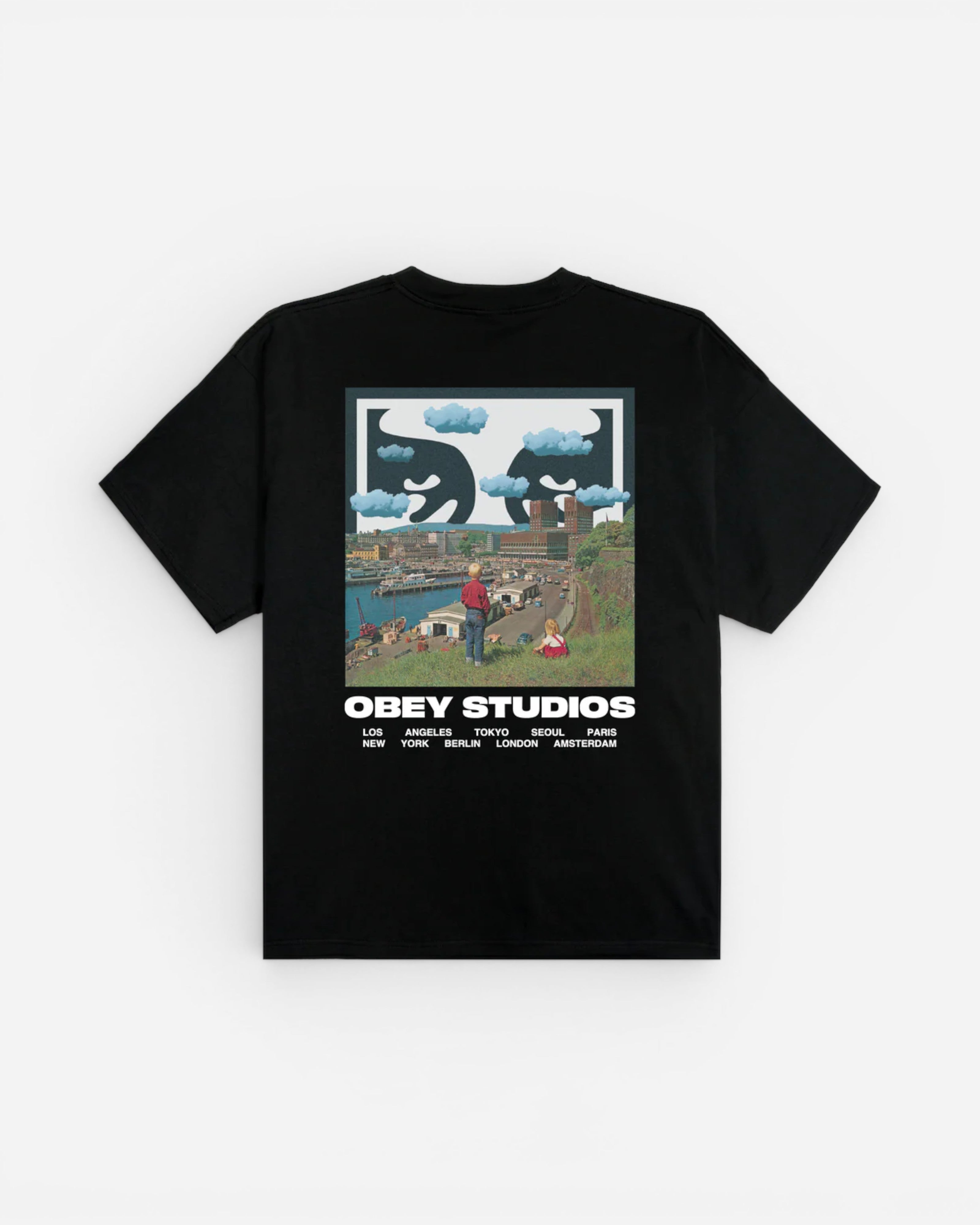 Astrofat black 100% cotton t-shirt with a graphic print on the back featuring a city skyline, clouds, and the text OBEY STUDIOS.