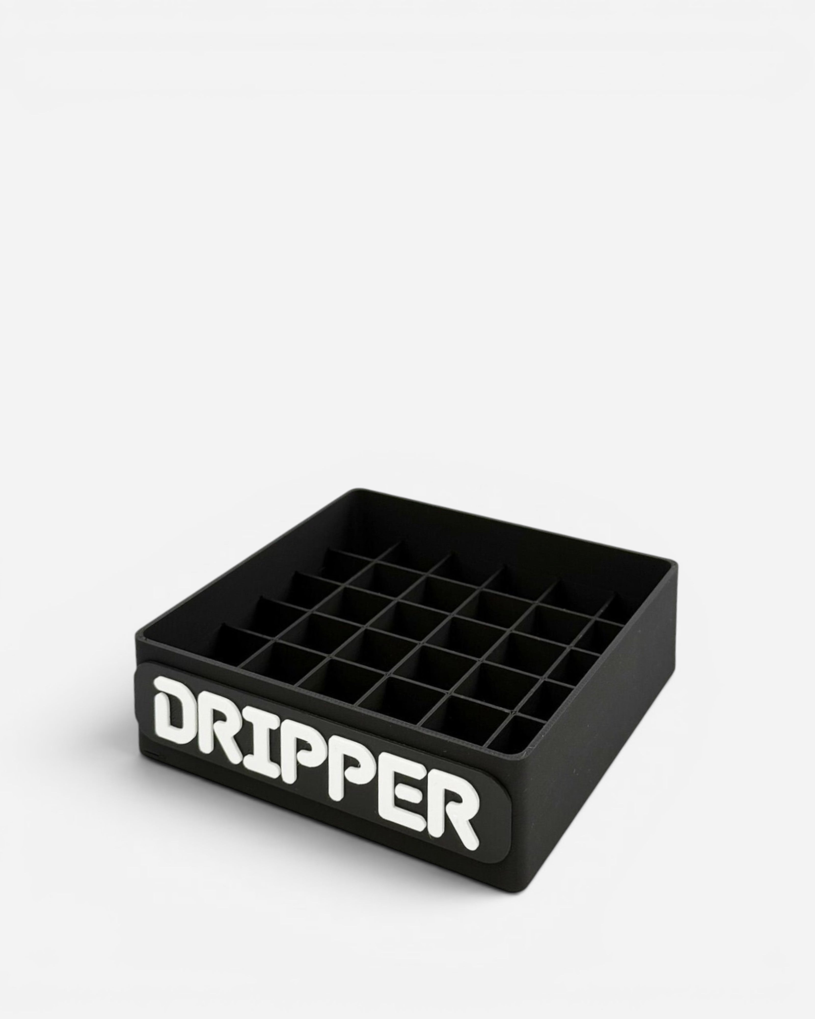 Astrofat black plastic marker organizer with 36 compartments and "DRIPPER" text on the front.