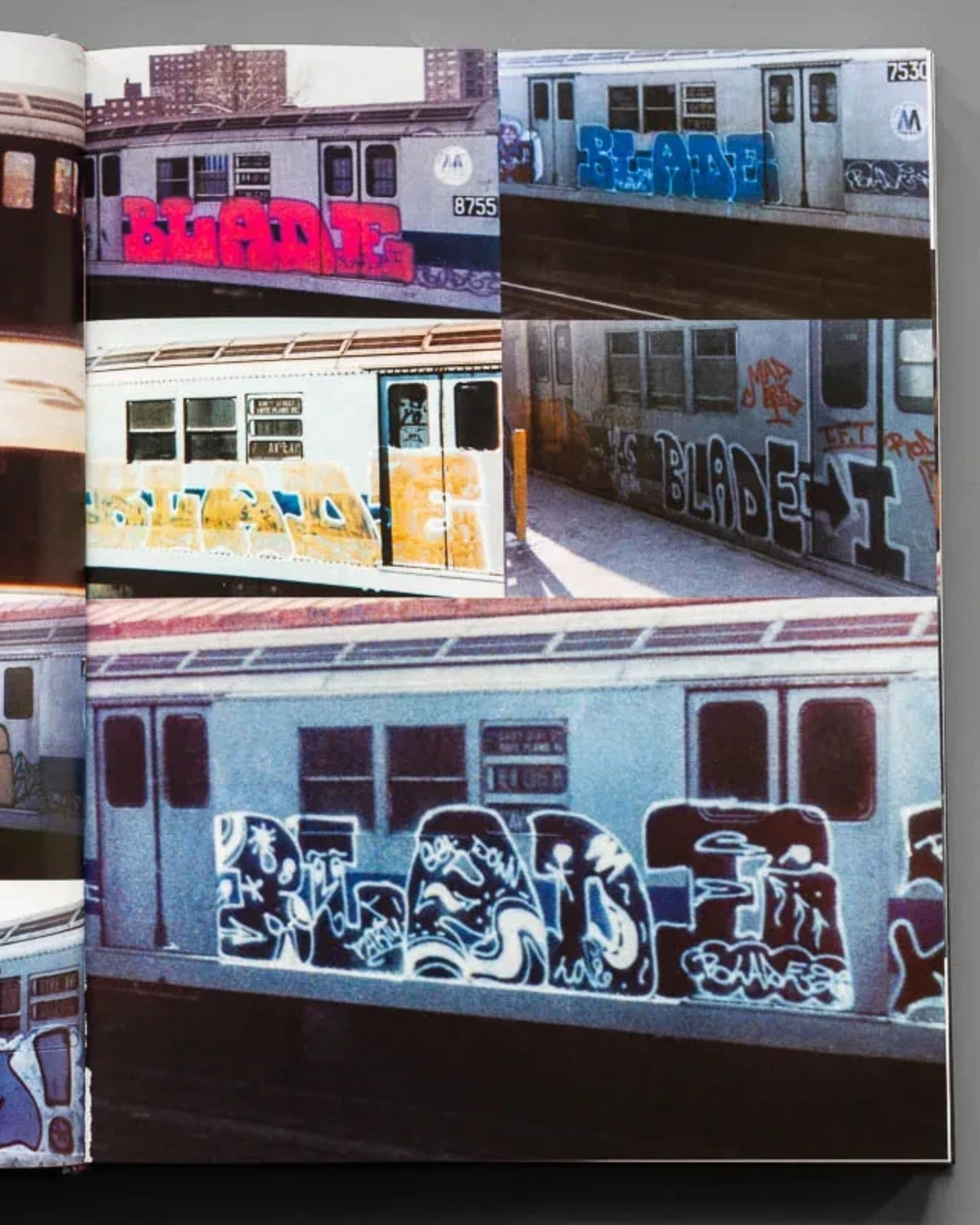 Astrofat BLADE King Of Graffiti hardcover book open to a spread featuring vintage photos of graffiti on NYC subway cars