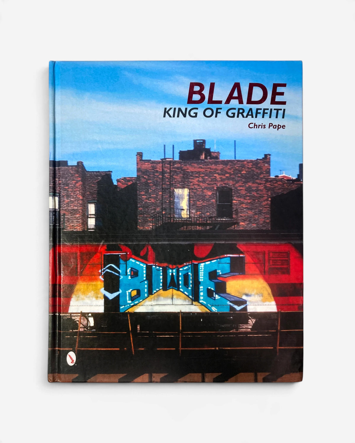 Astrofat BLADE King Of Graffiti hardcover book featuring a vibrant subway train mural against a brick building