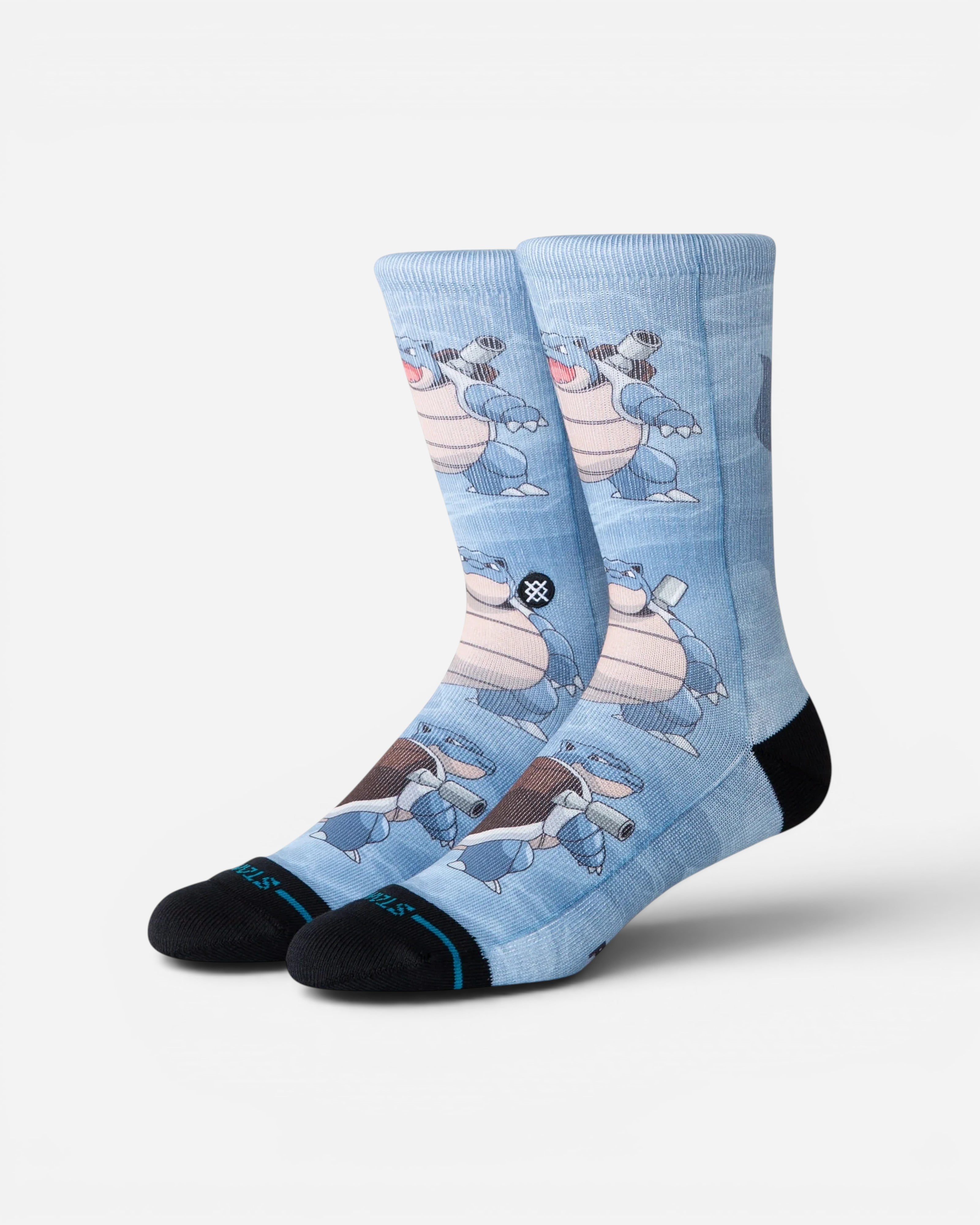 Astrofat Pokemon Blastoise crew socks in light blue with an all-over character print, black toe, and heel detailing.
