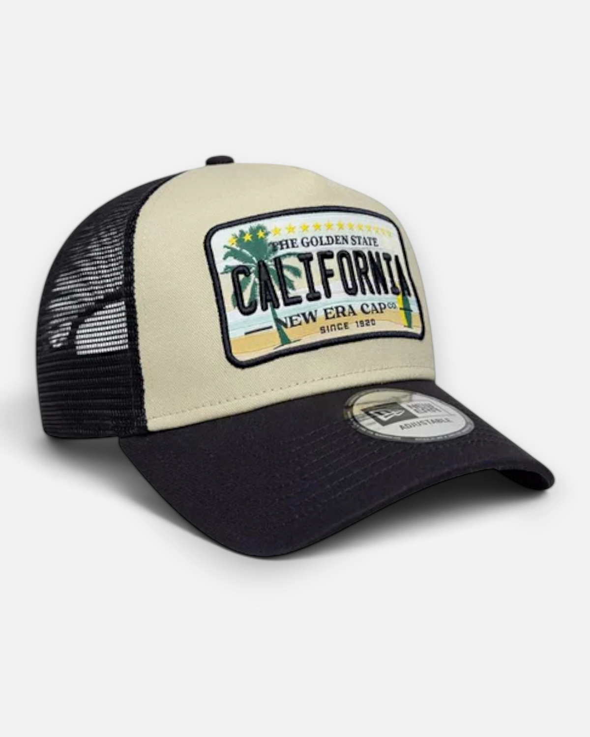 Astrofat 9FORTY trucker cap in cream and navy with a California graphic patch, curved visor, and mesh back.