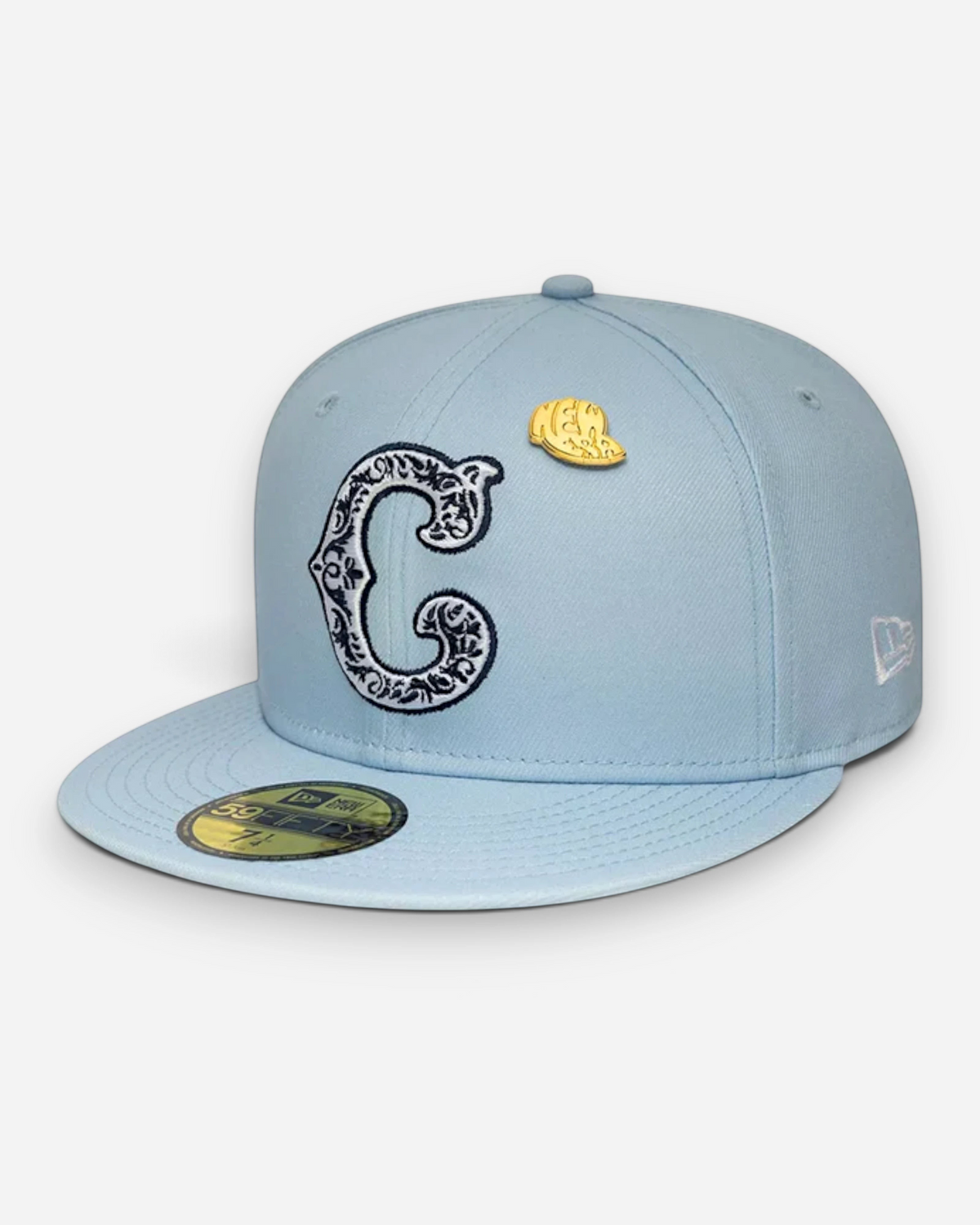 Astrofat light blue Chicago Cubs 59FIFTY fitted cap with ornate C logo and a small gold New Era pin on the crown.