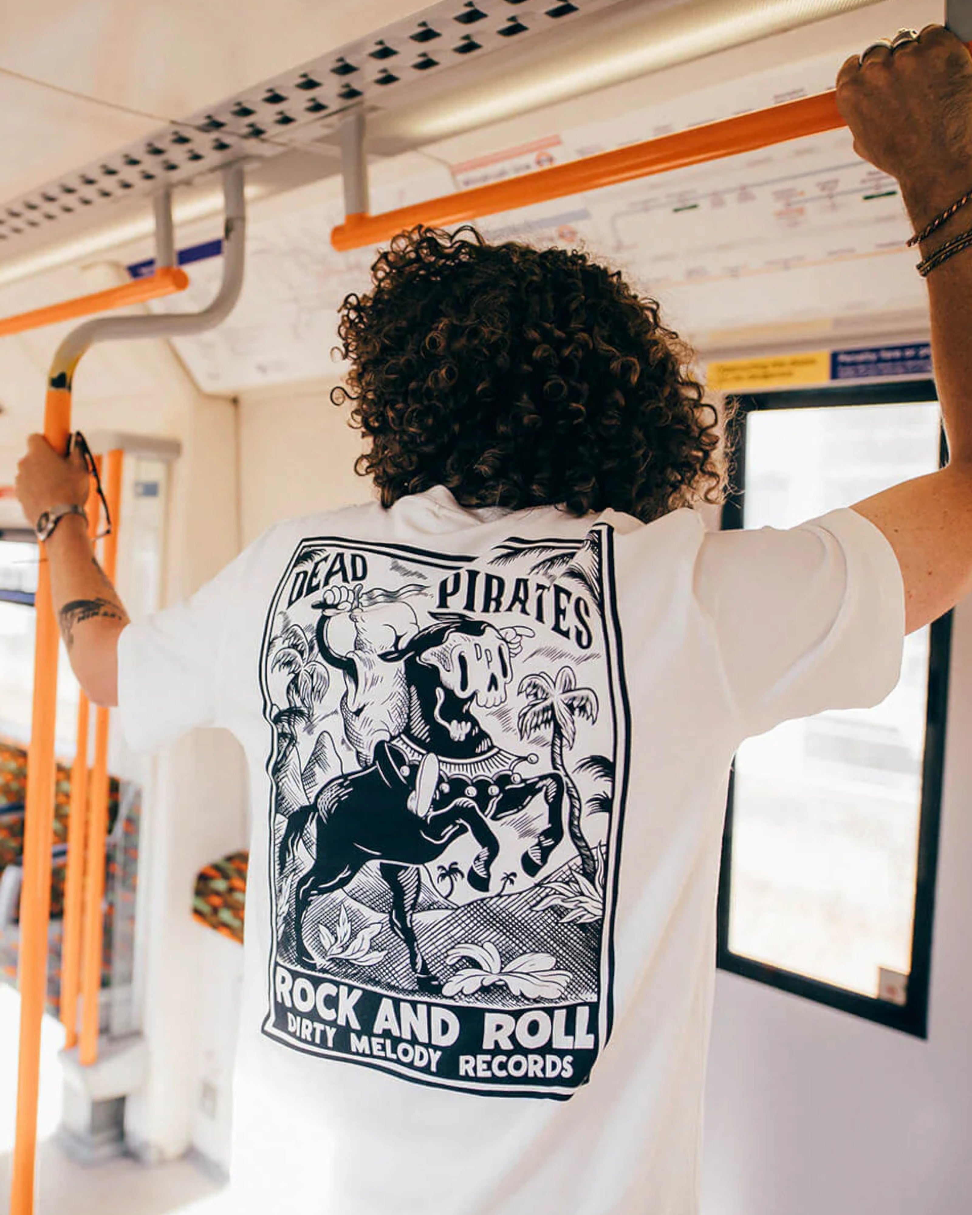 Astrofat off-white 100% organic cotton t-shirt with a black Dead Pirates graphic print on the back.