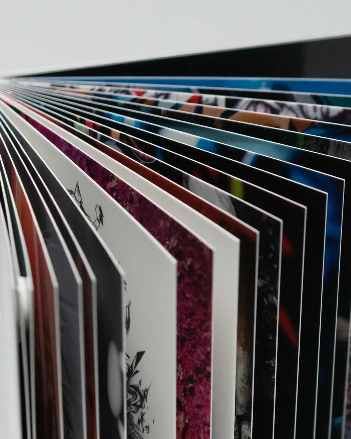 Astrofat DOES Fragments art book showing open pages with colorful graffiti sketches and artistic designs