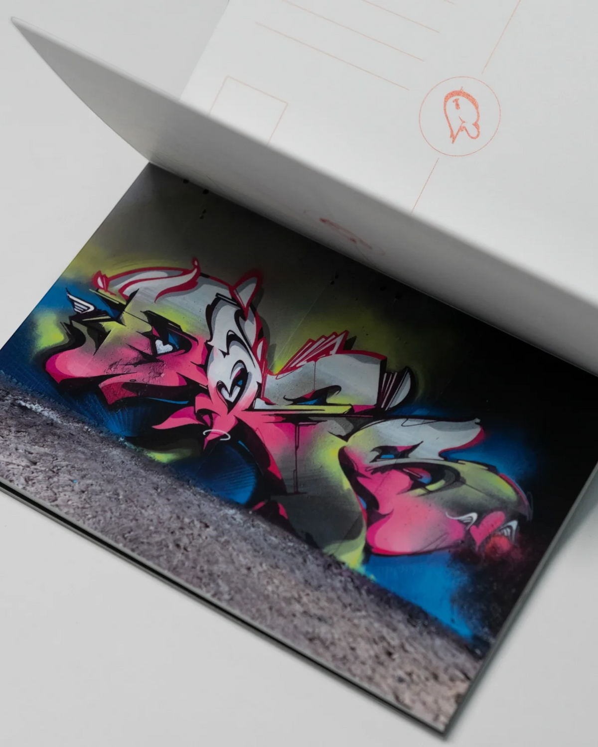 Astrofat DOES Pieces postcard set featuring vibrant graffiti art prints in a limited edition booklet format