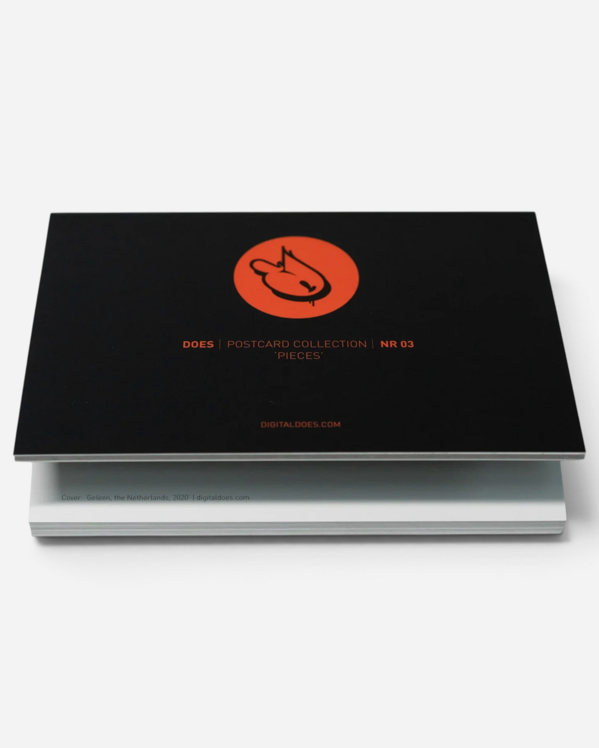 Astrofat DOES Pieces postcard set N°3 featuring a black cover with a circular orange logo on a white background.