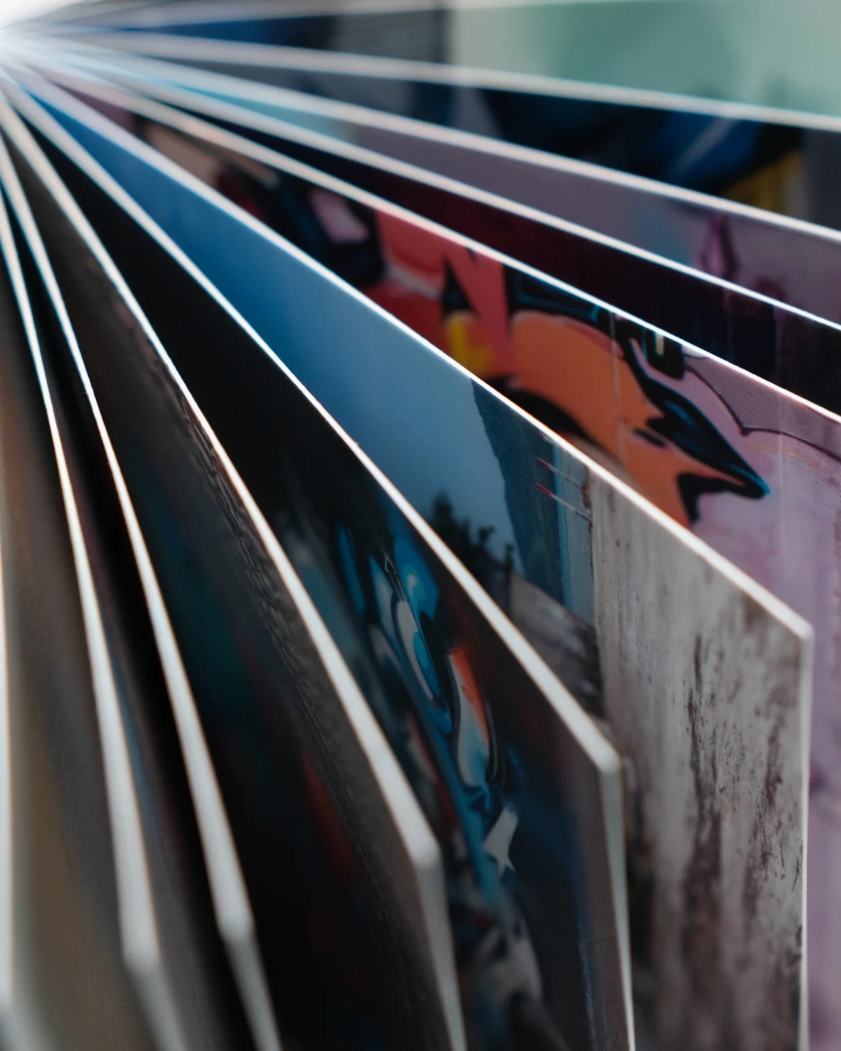 Astrofat DOES Pieces postcard set N°3 featuring a collection of 20 vibrant graffiti art prints in a booklet format.