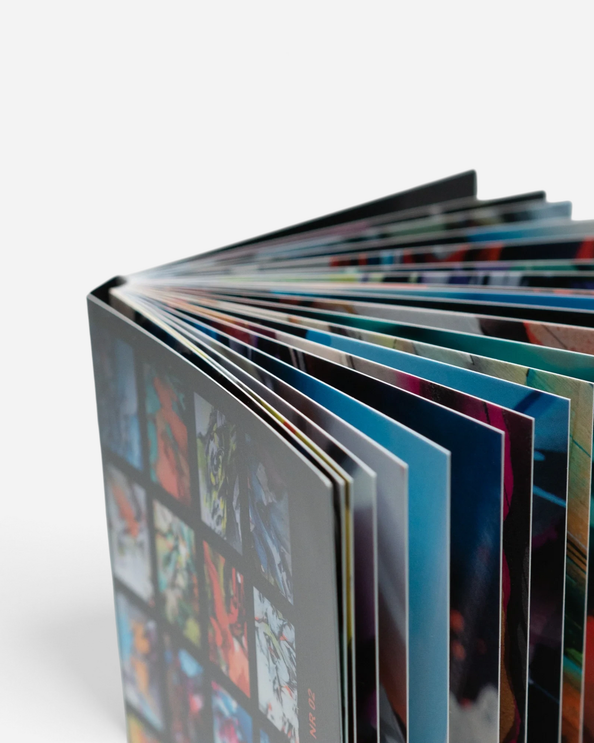 Astrofat DOES Close Up postcard set N°2 featuring 20 vibrant art prints bound as a booklet on a white background.