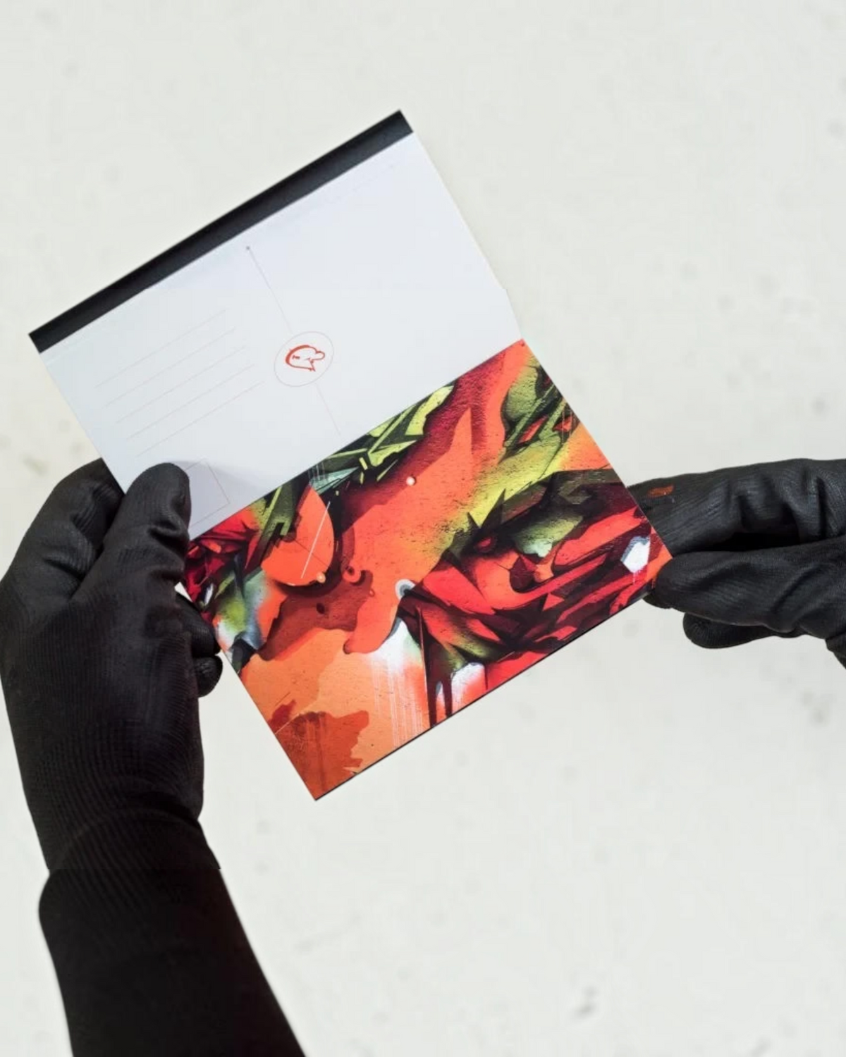 Astrofat DOES Close Up postcard set featuring vibrant abstract graffiti art in red, orange, and green tones.