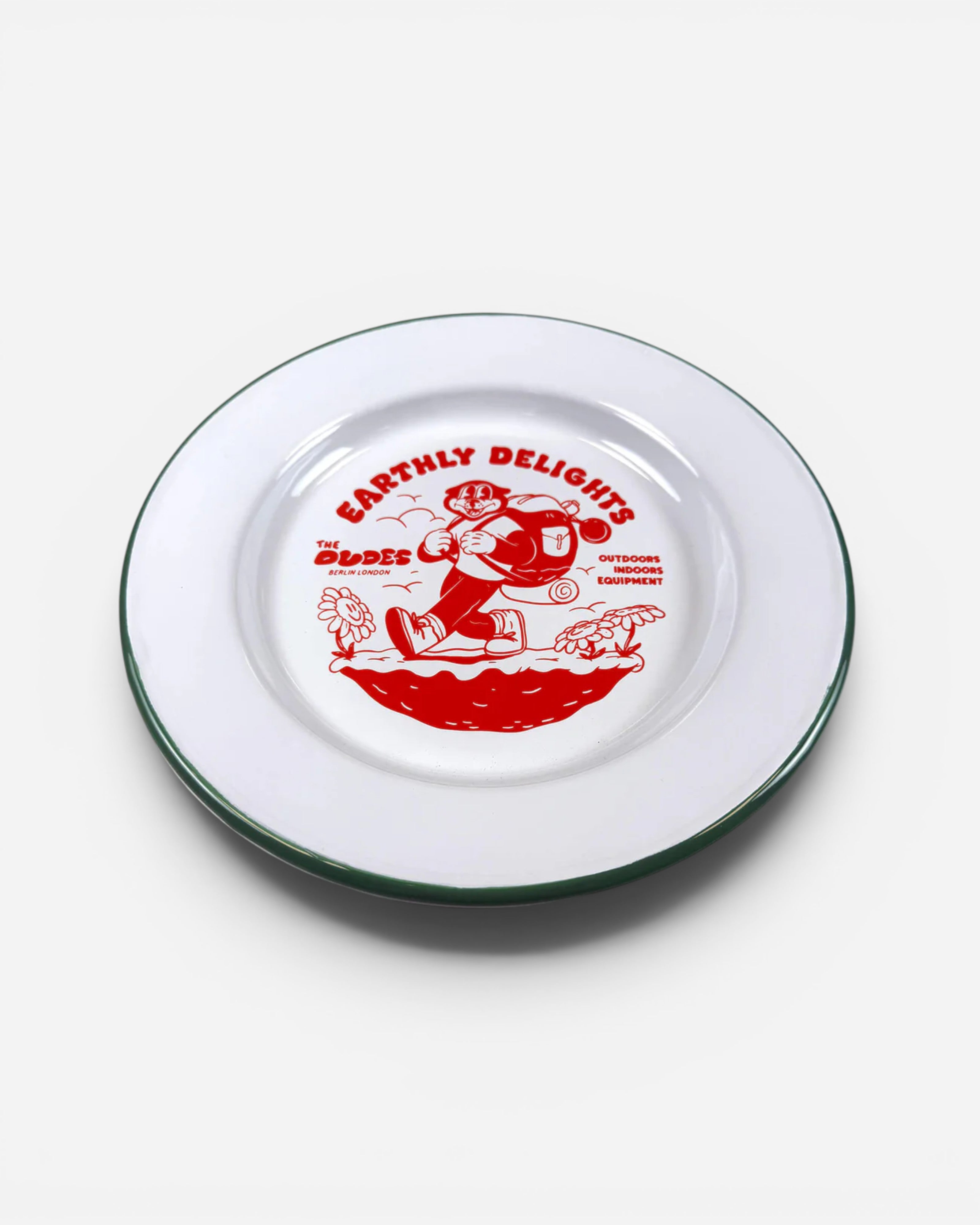 Astrofat ivory enameled plate with green rim, featuring a red "Earthly Delights" illustration of a character with a backpack and flowers.