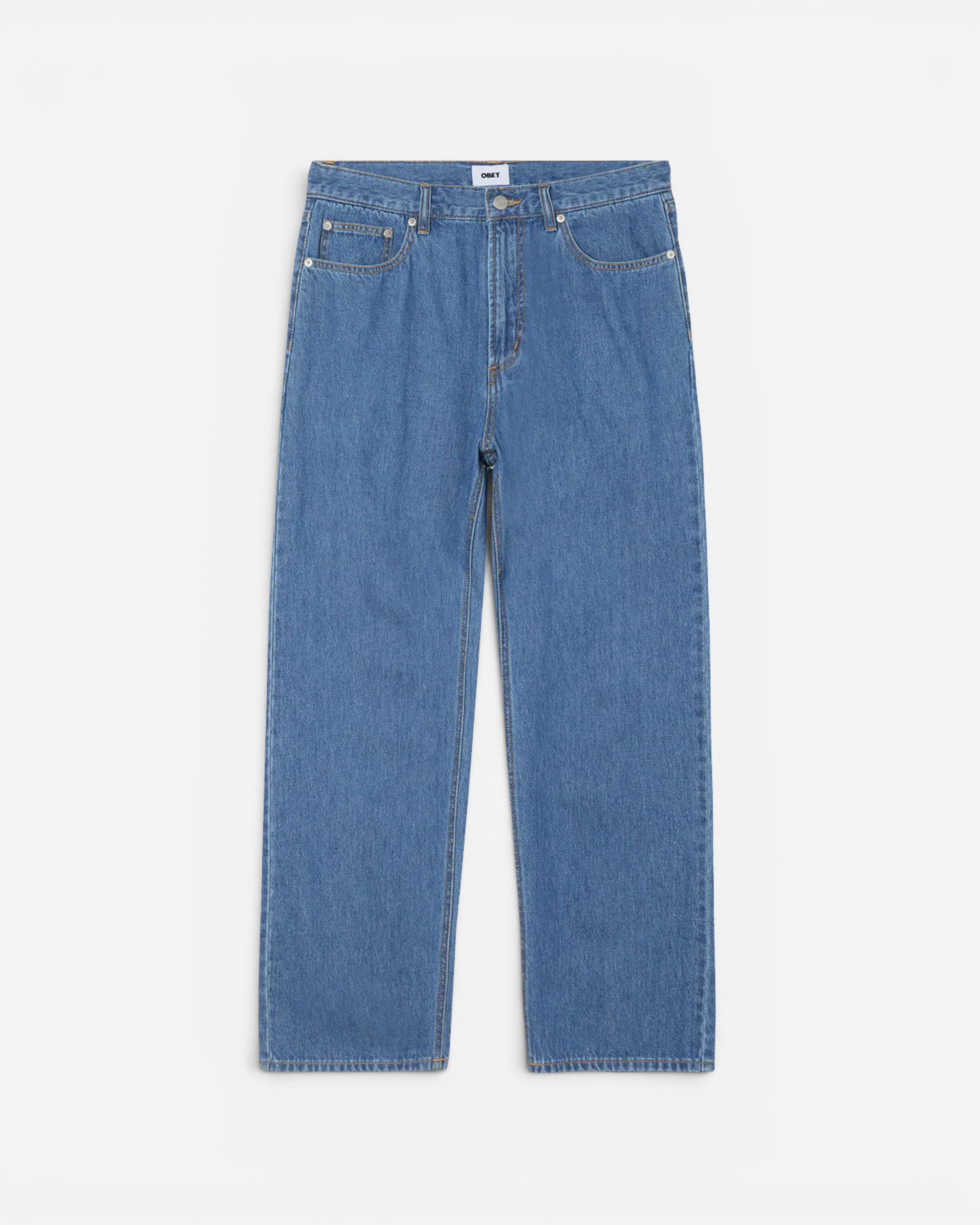 Astrofat Emerson Denim Pant in Salty Blue Stone Wash. These 100% cotton jeans feature a relaxed fit, five pockets, and a tapered leg.