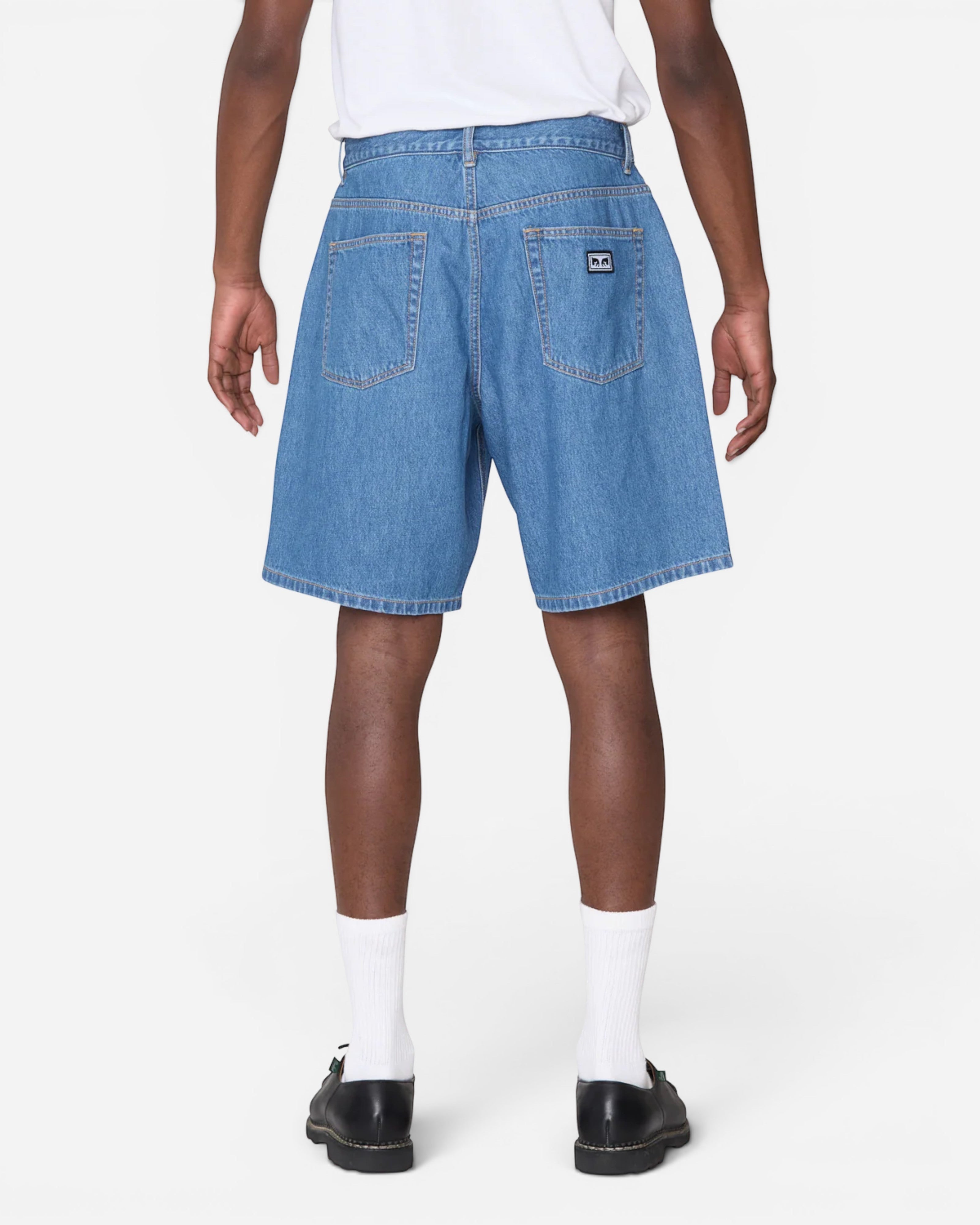 Astrofat Emerson Denim Short in Salty Blue Stone Wash. Baggy fit denim shorts with 5-pocket styling and button/zip closure.