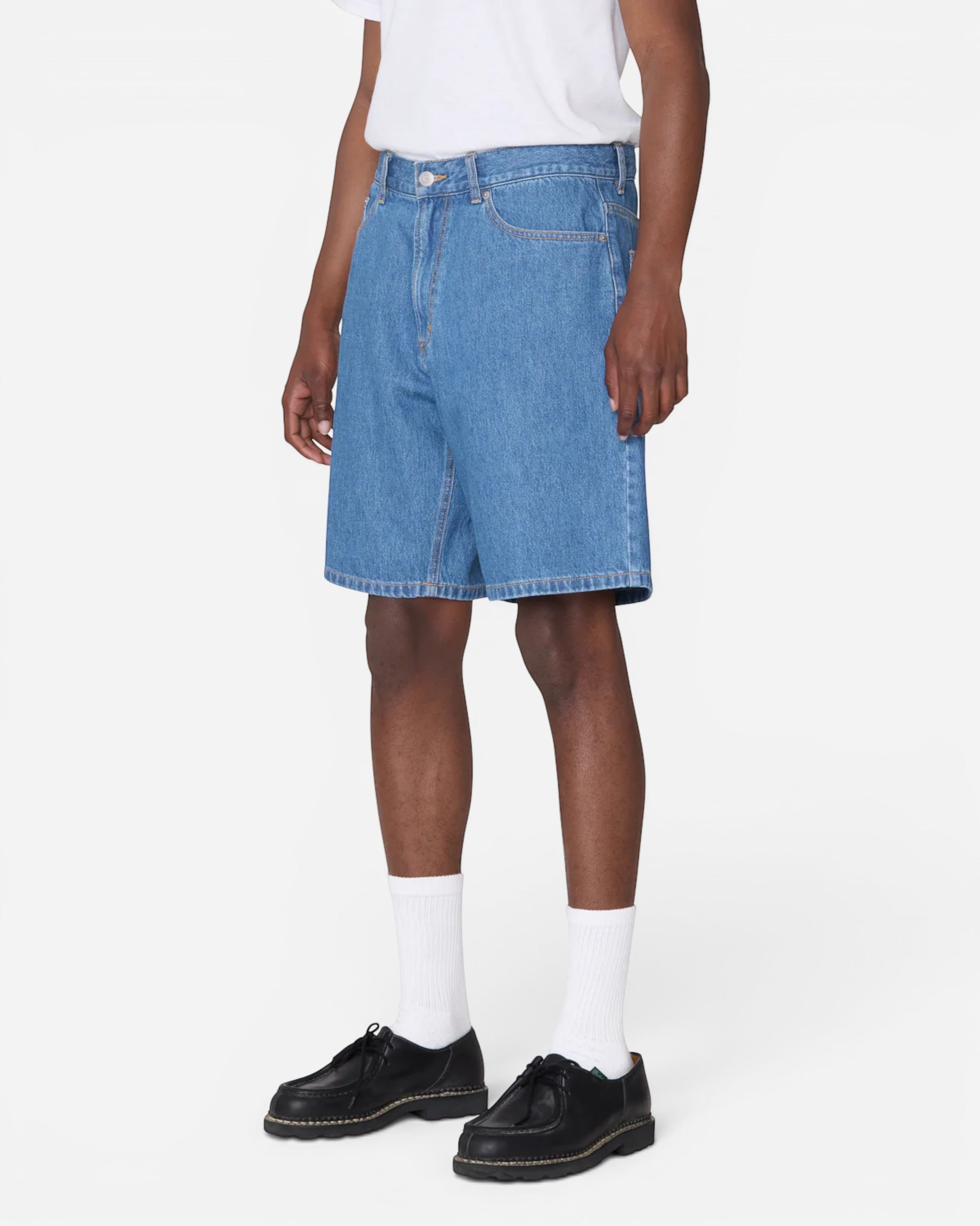 Astrofat Emerson Denim Short in Salty Blue Stone Wash. These baggy fit denim shorts feature a button and zip closure and a 5-pocket style.