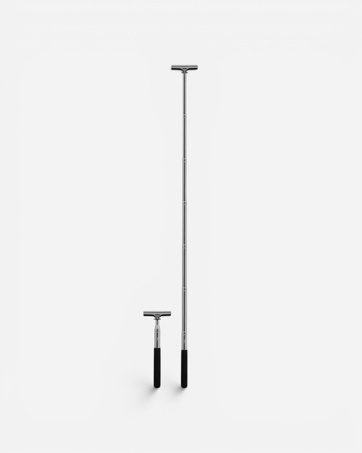 Astrofat extendable sticker pole shown in both collapsed and fully extended positions for street art application.