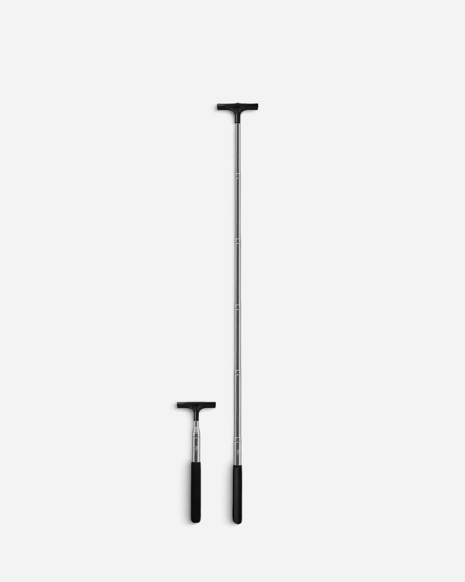 Astrofat extendable sticker pole shown in both collapsed and fully extended 80cm positions for street art application.