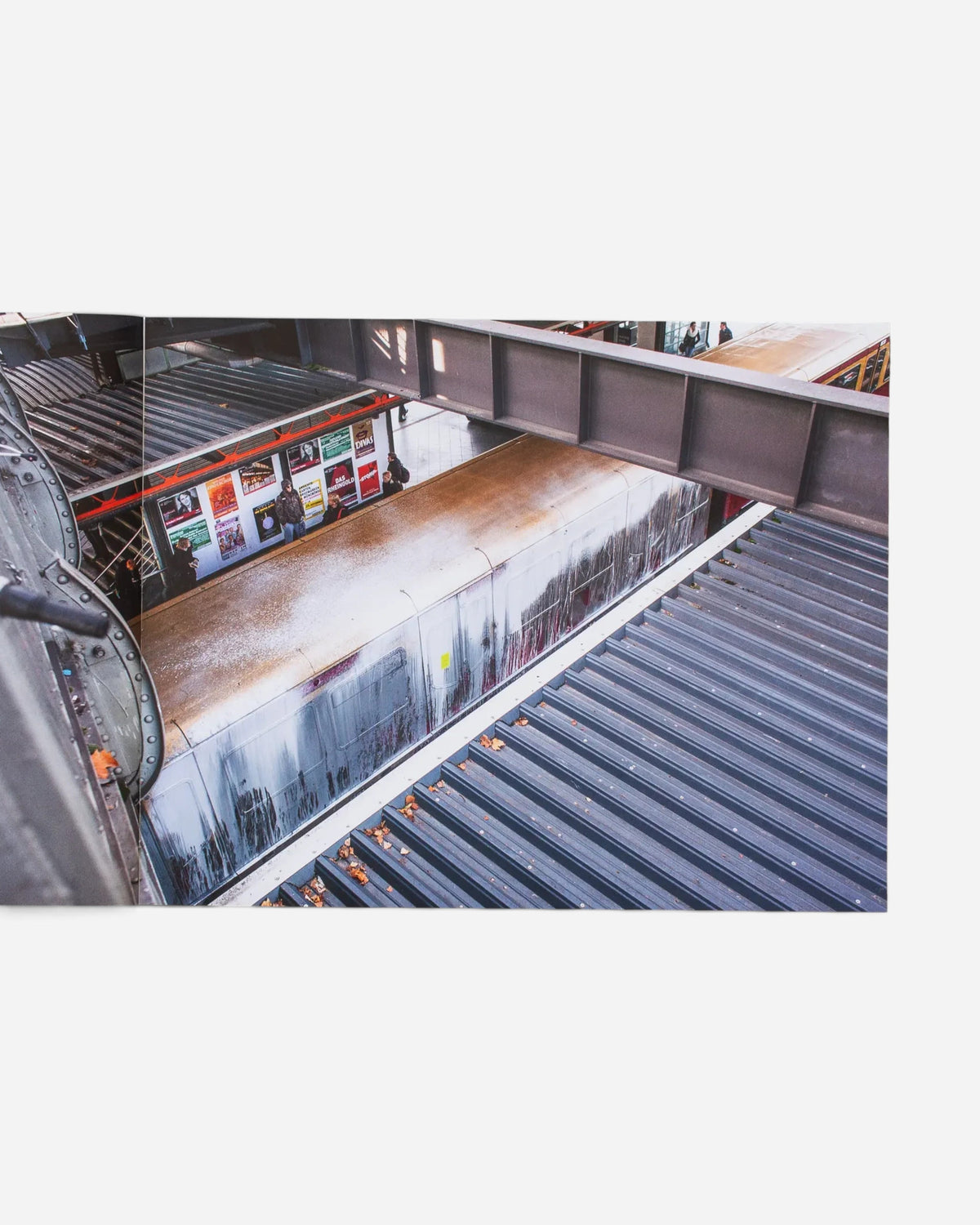 Astrofat Farbzüge photography book open to a spread showing a graffiti-covered Berlin train from an elevated perspective.