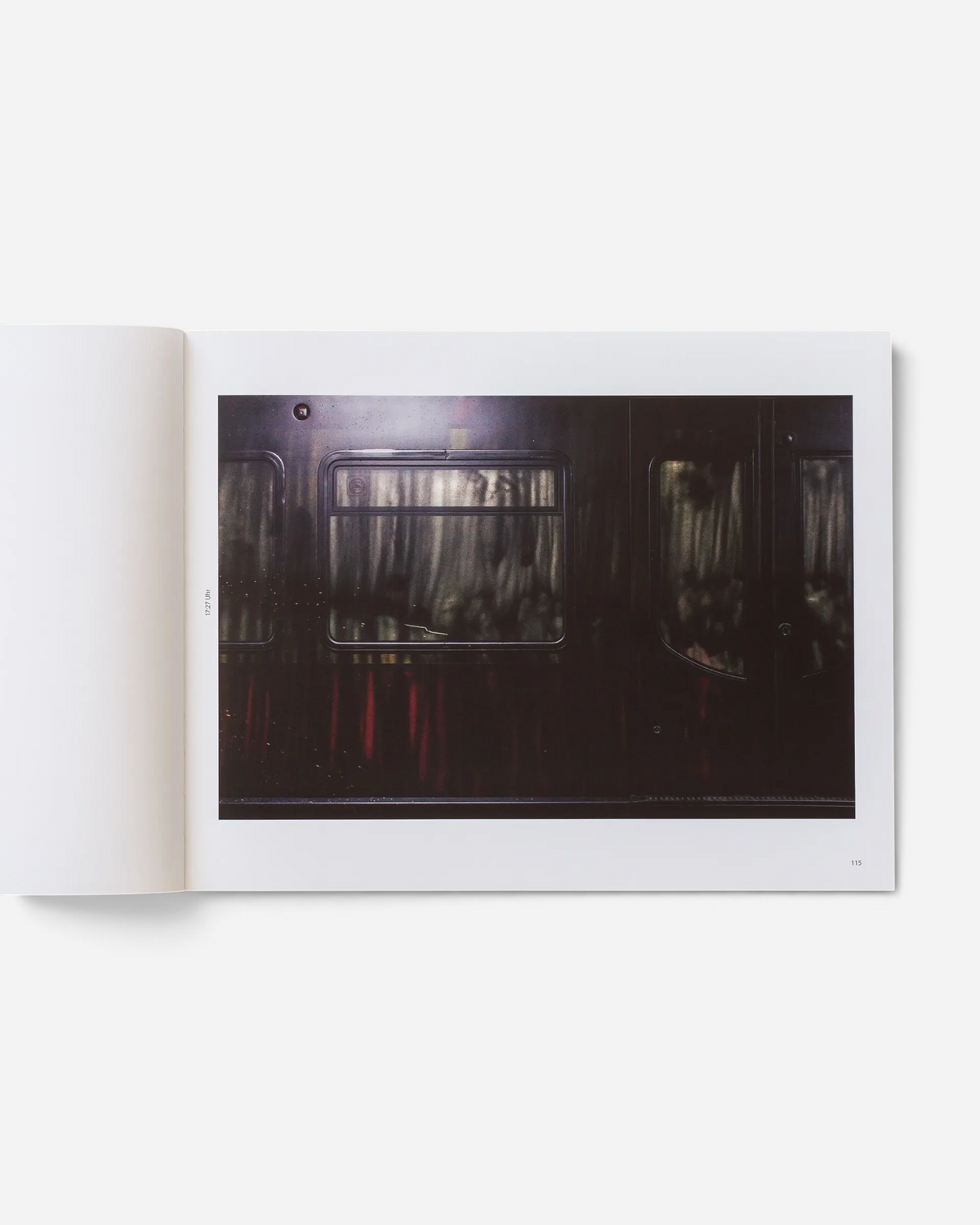 A page from the Astrofat book Farbzüge showing a dark, atmospheric photograph of a graffiti-covered train carriage.