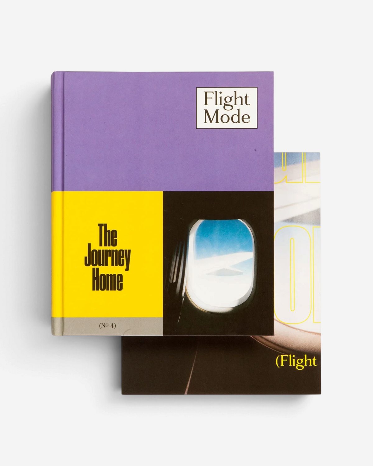Astrofat Flight Mode 4 The Journey Home art book featuring a purple, yellow, and black cover with airplane window art.