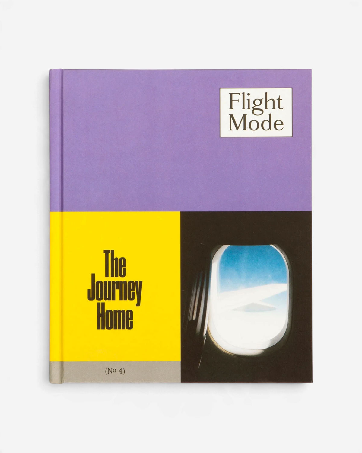 Astrofat Flight Mode 4 The Journey Home hardcover book featuring a purple, yellow, and black cover with airplane window