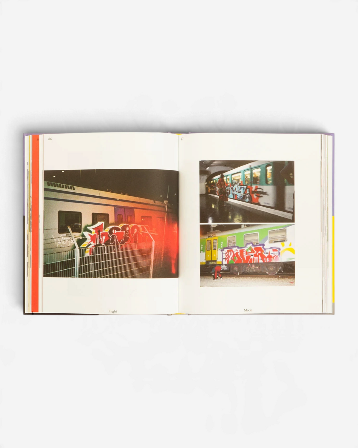 Astrofat Flight Mode 4 book open to pages 86 and 87 showing graffiti art on trains and experimental digital designs.