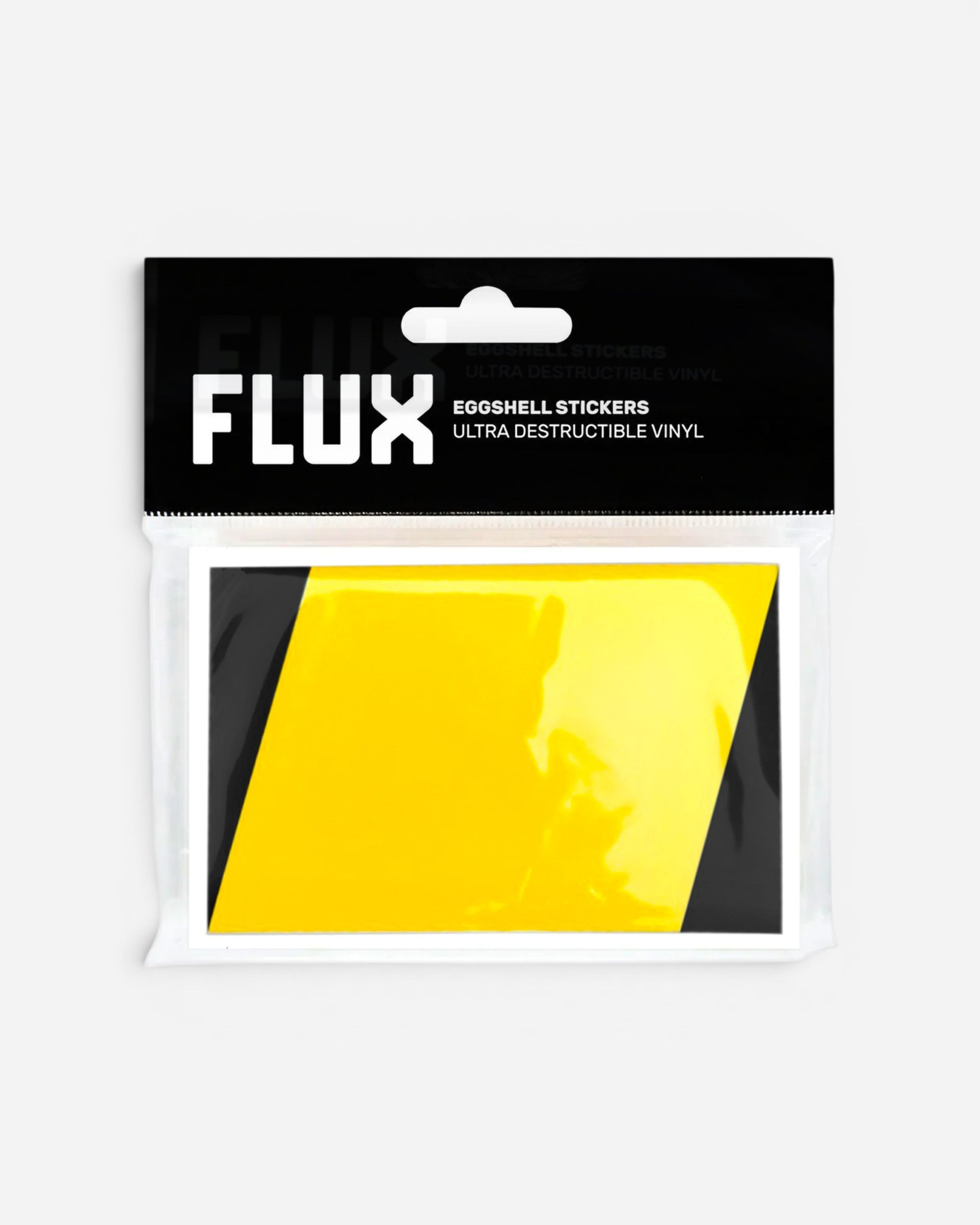 Astrofat FLUX eggshell stickers in black and yellow, 50-pack of ultra-destructible vinyl labels for street art tags.