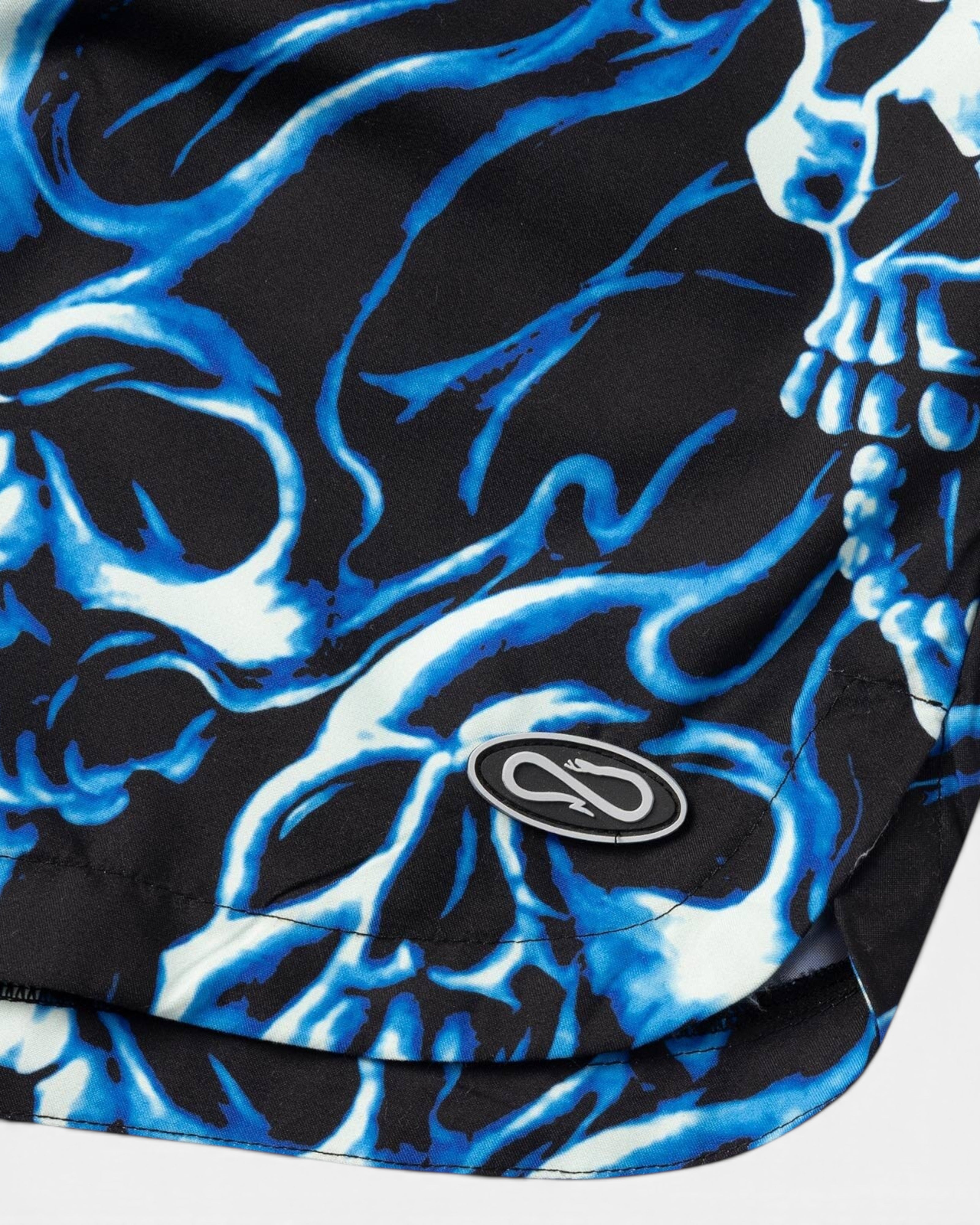 Astrofat Ghostrider swim trunks featuring a black and blue all-over skull flame print with a branded woven label.