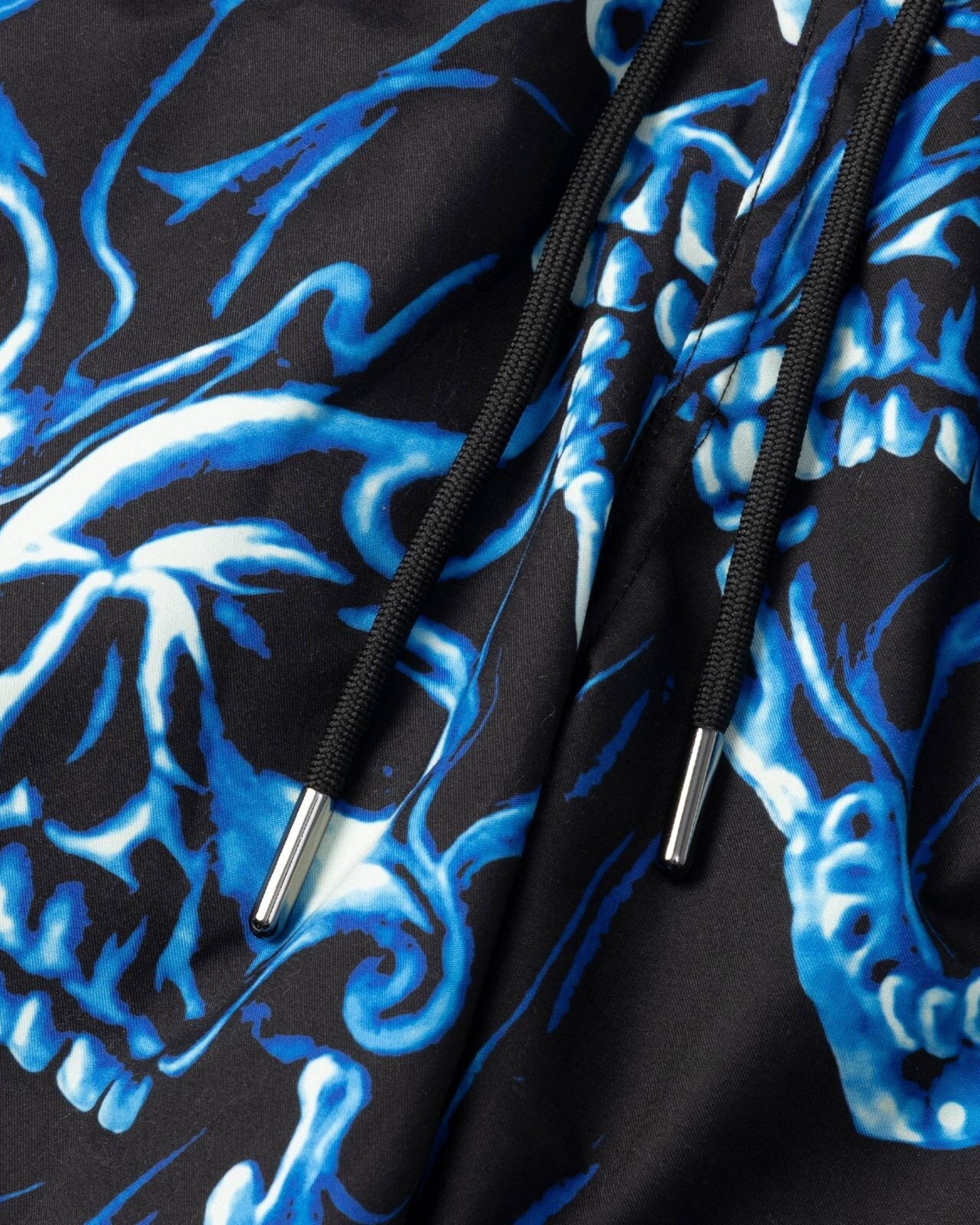 Astrofat Ghostrider swim trunks in black with an all-over blue skull print, featuring a black drawstring waist.
