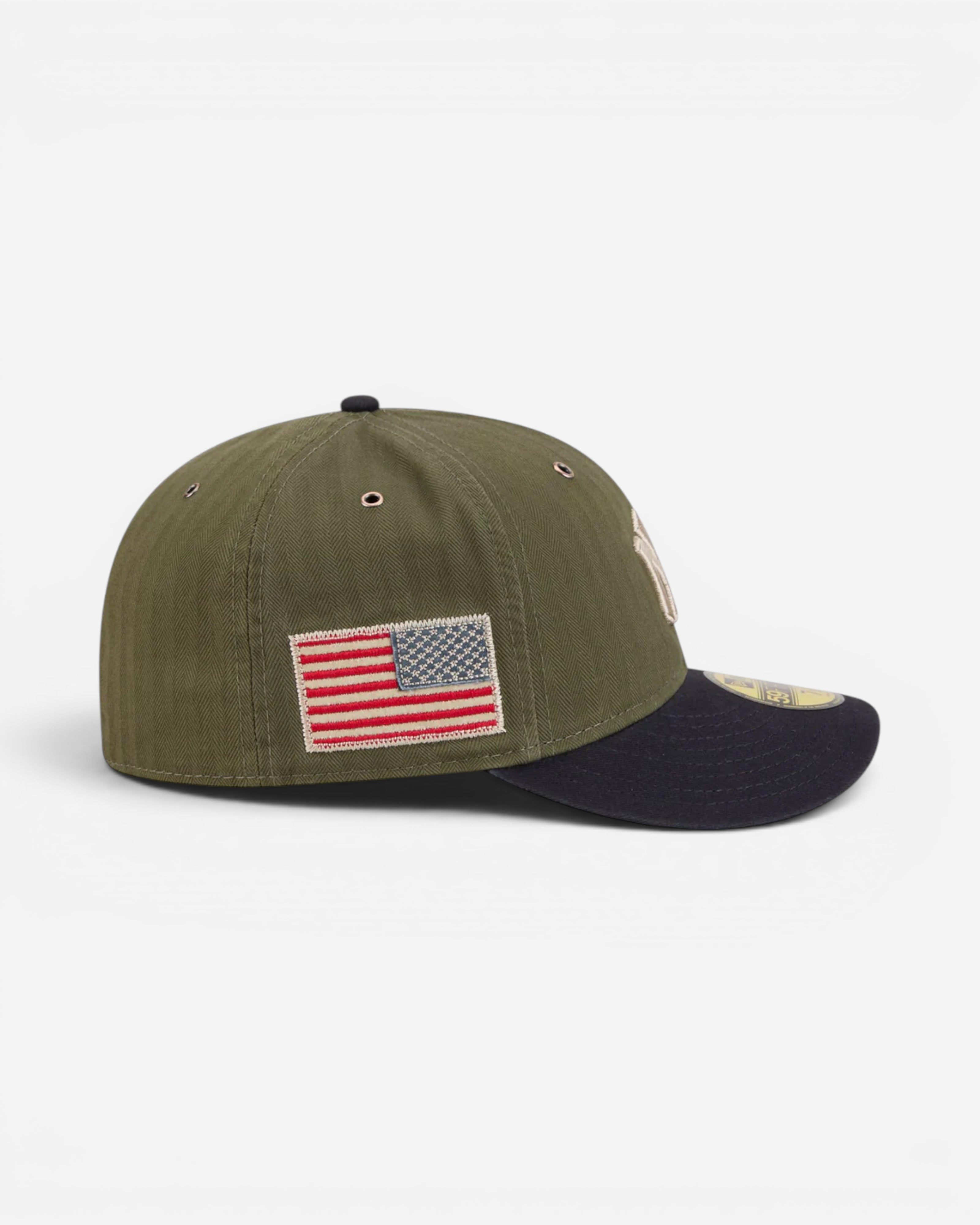 Astrofat olive green herringbone fitted cap with black brim and American flag patch on side.