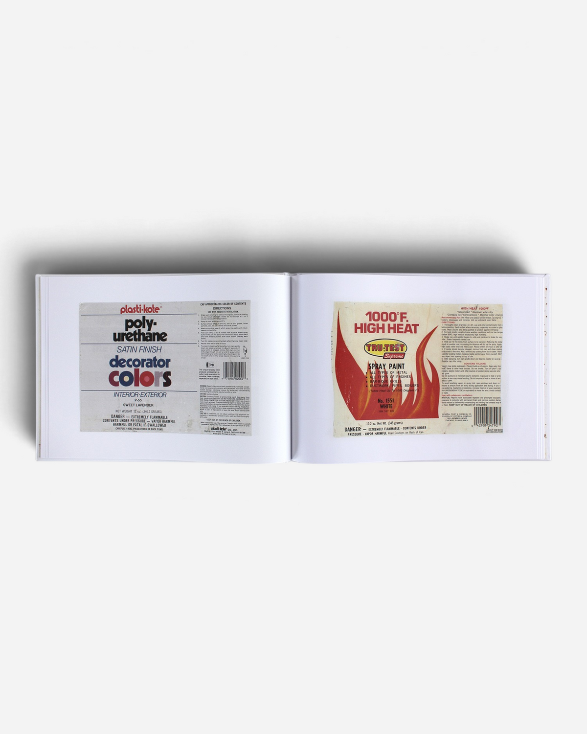 Astrofat Kept Paper Labels art book open to a page showing vintage Plasti-Kote and Tru-Test spray paint can labels.