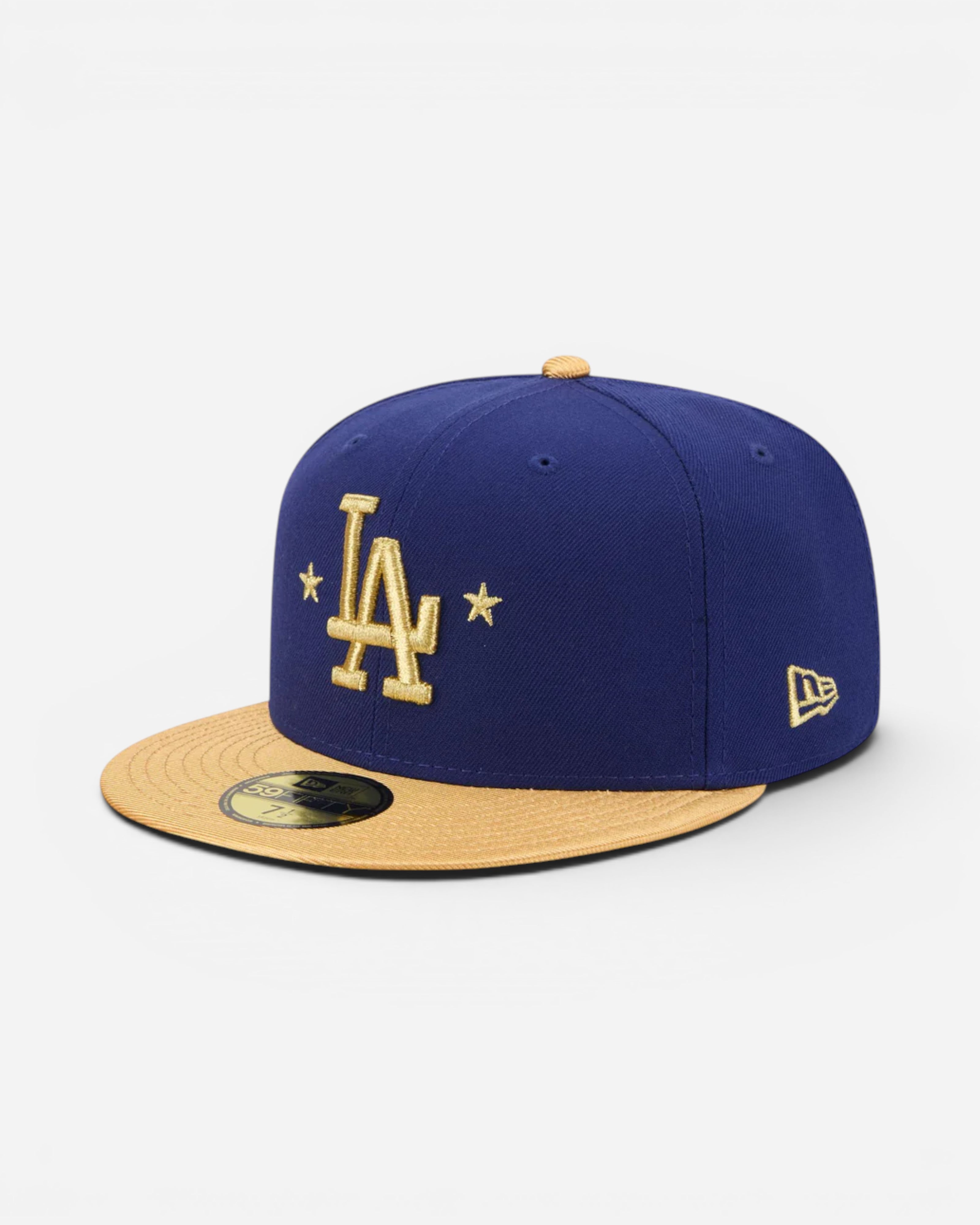 Astrofat dark blue fitted baseball cap with gold LA Dodgers logo and flat brim. Features embroidered details and New Era flag.
