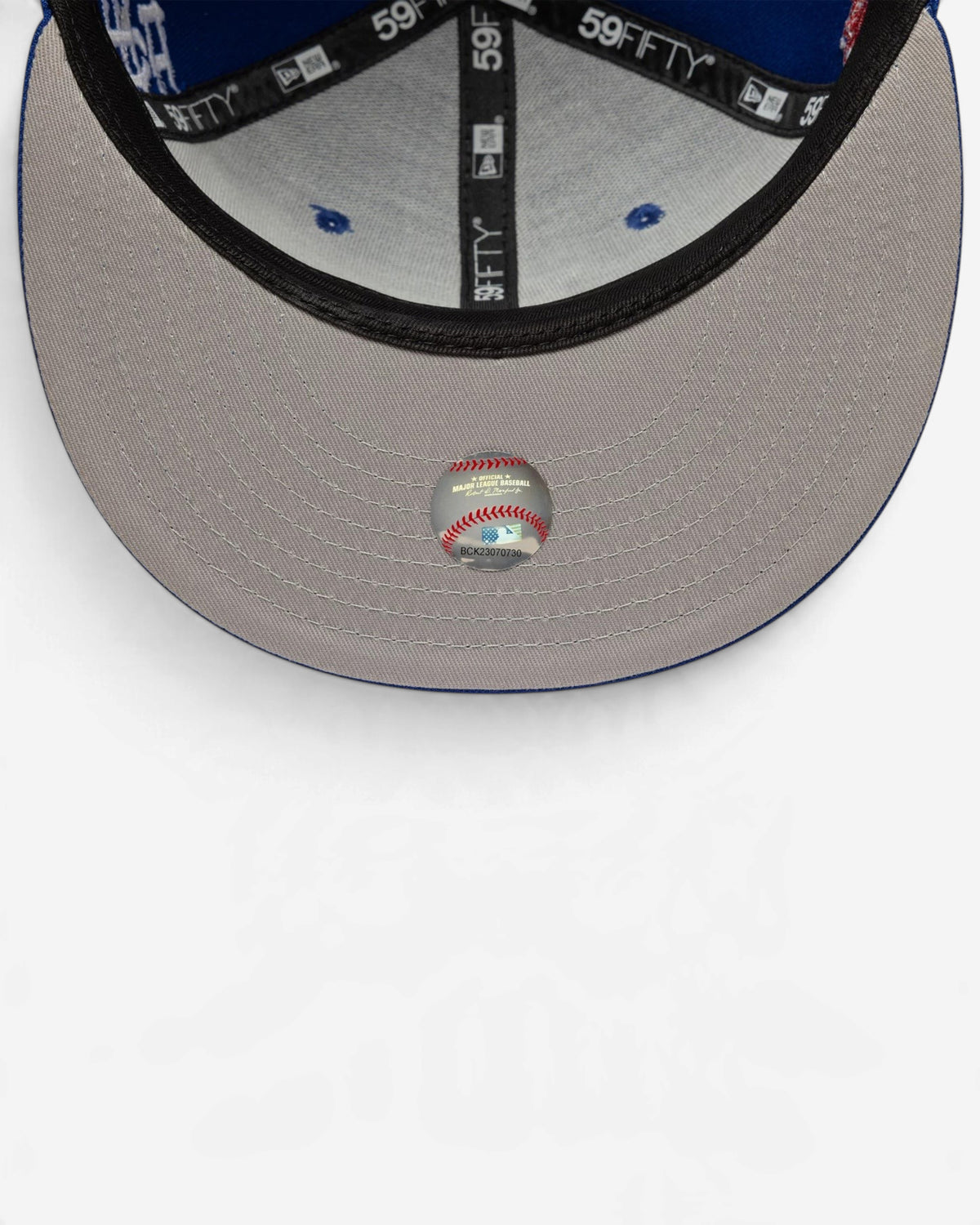 Astrofat 59FIFTY LA Dodgers fitted cap featuring a blue crown, flat visor, and a grey undervisor with MLB sticker.