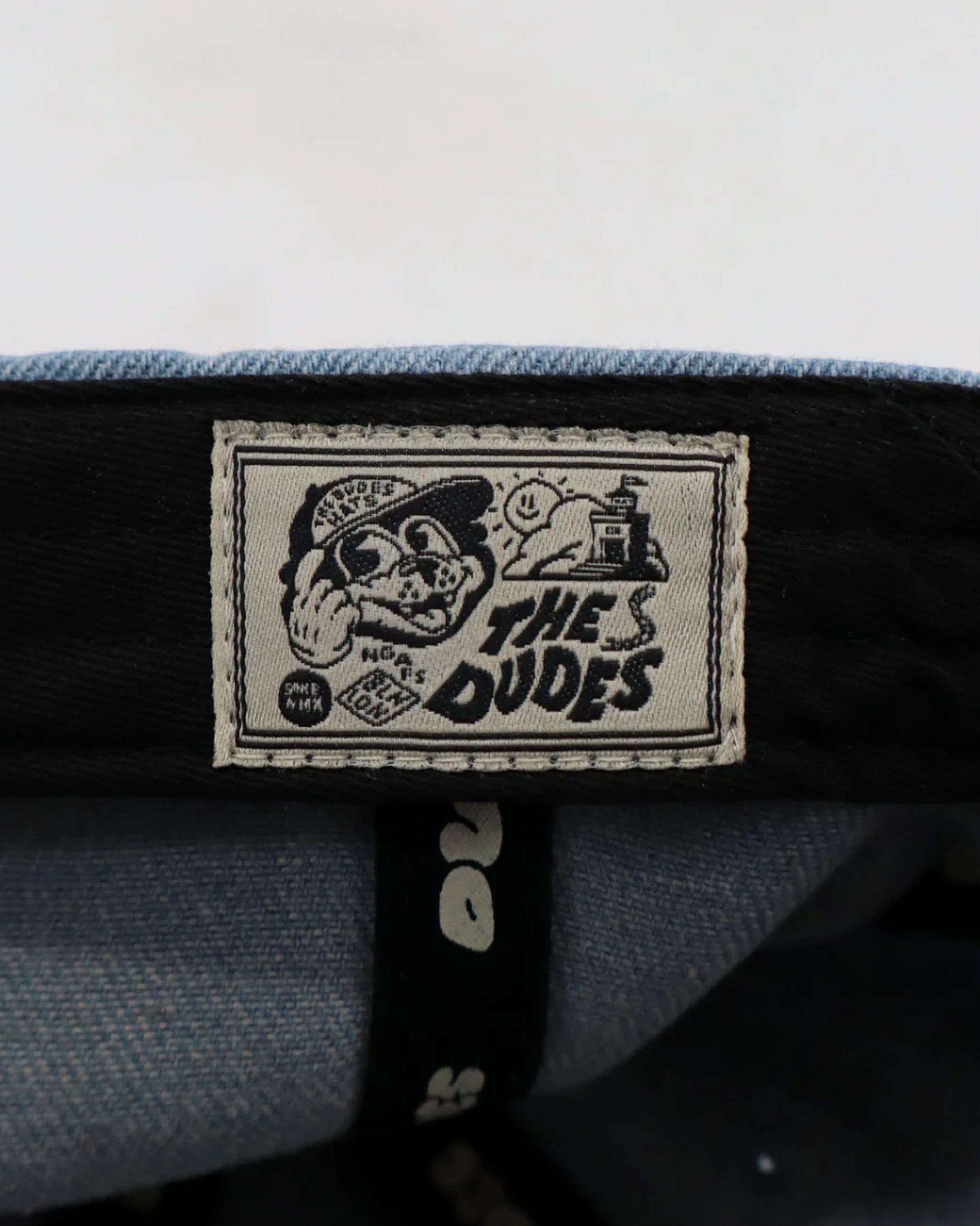 Astrofat light blue denim cap with embroidered "The Dudes" logo and graphic detail. Unisex, one size fits all.