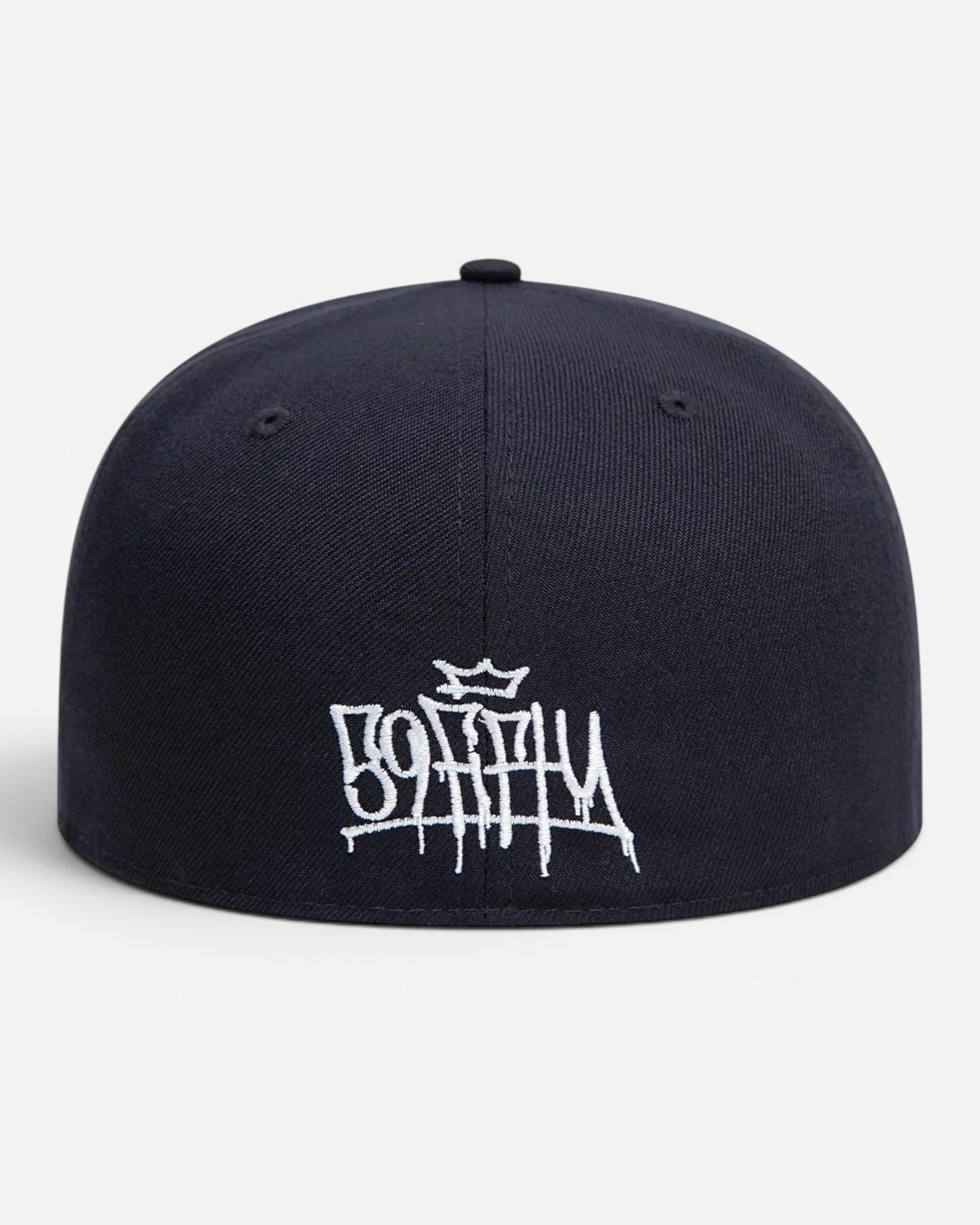 Astrofat navy blue 59FIFTY New Era cap featuring white graffiti tag embroidery on the front and a structured crown.