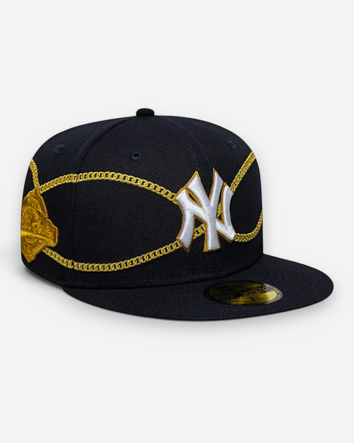 Astrofat navy 59FIFTY fitted cap featuring a white New York Yankees logo and gold chain wrap embroidery.