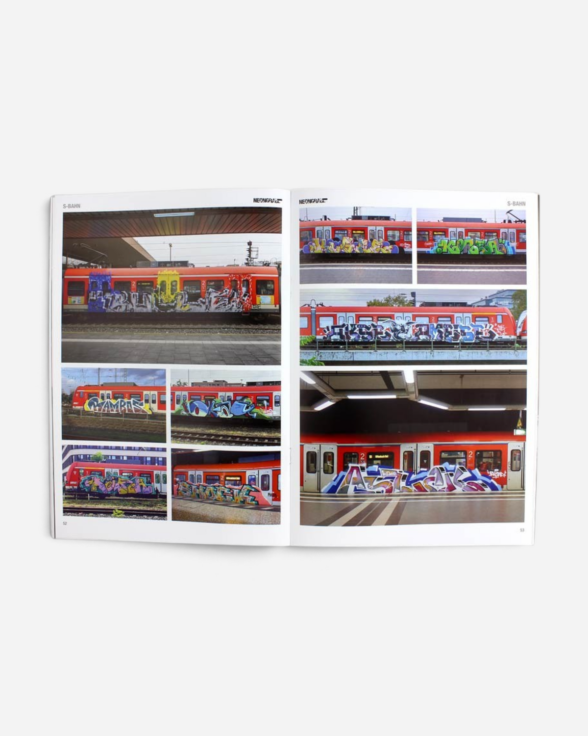 Astrofat Neongrau Magazine Issue 13 open spread showing graffiti art on red S-Bahn trains and regional railway cars.