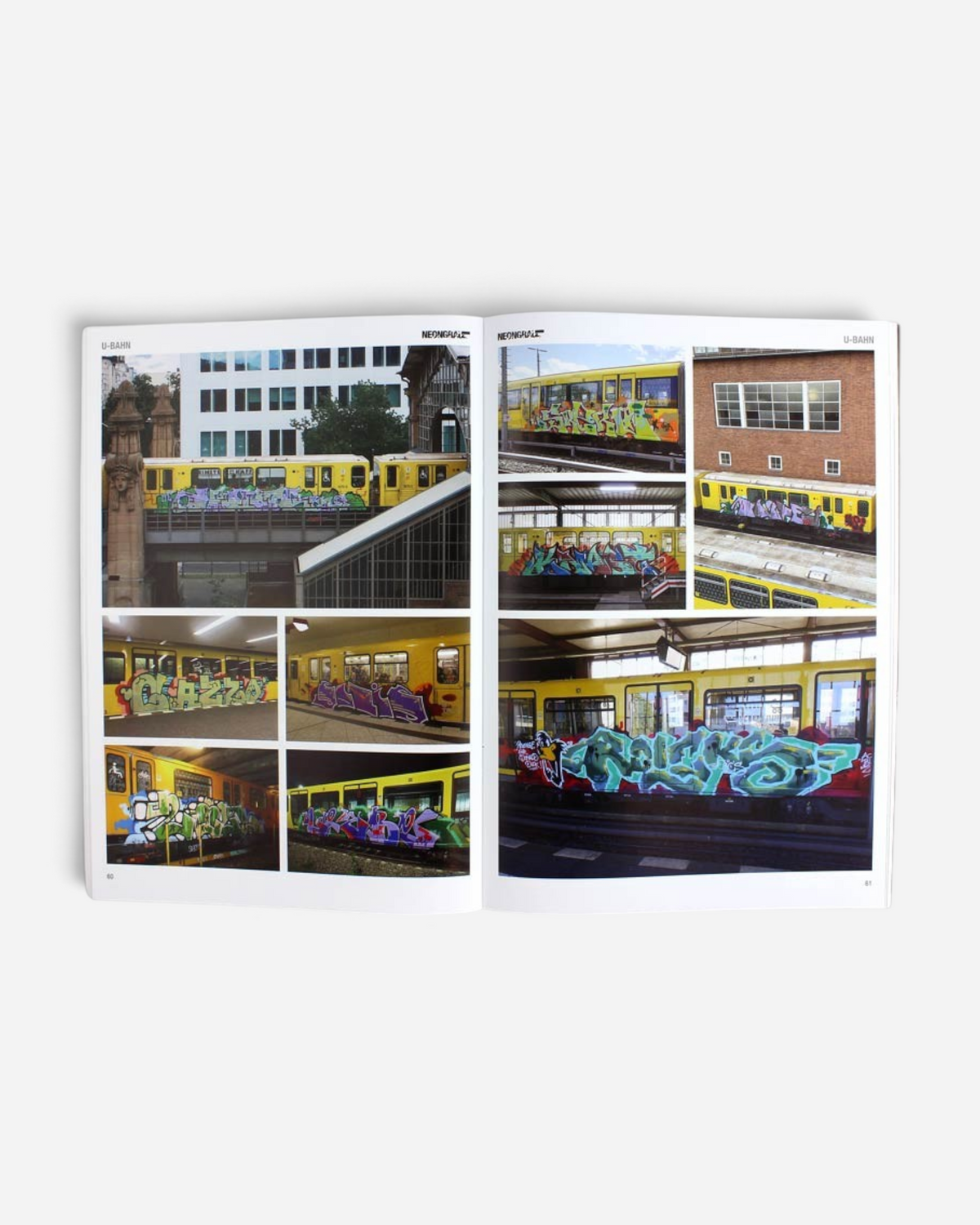 Astrofat Neongrau Magazine Issue 13 open to pages showing graffiti art on yellow U-Bahn subway trains
