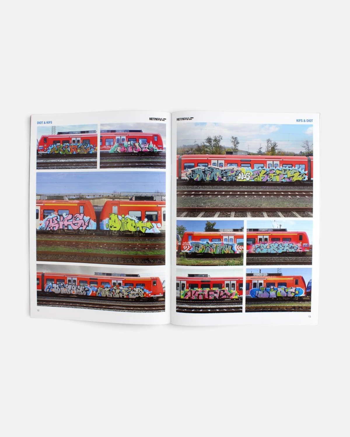 Astrofat Neongrau Magazine Issue 13 open to pages featuring colorful graffiti art on red regional trains