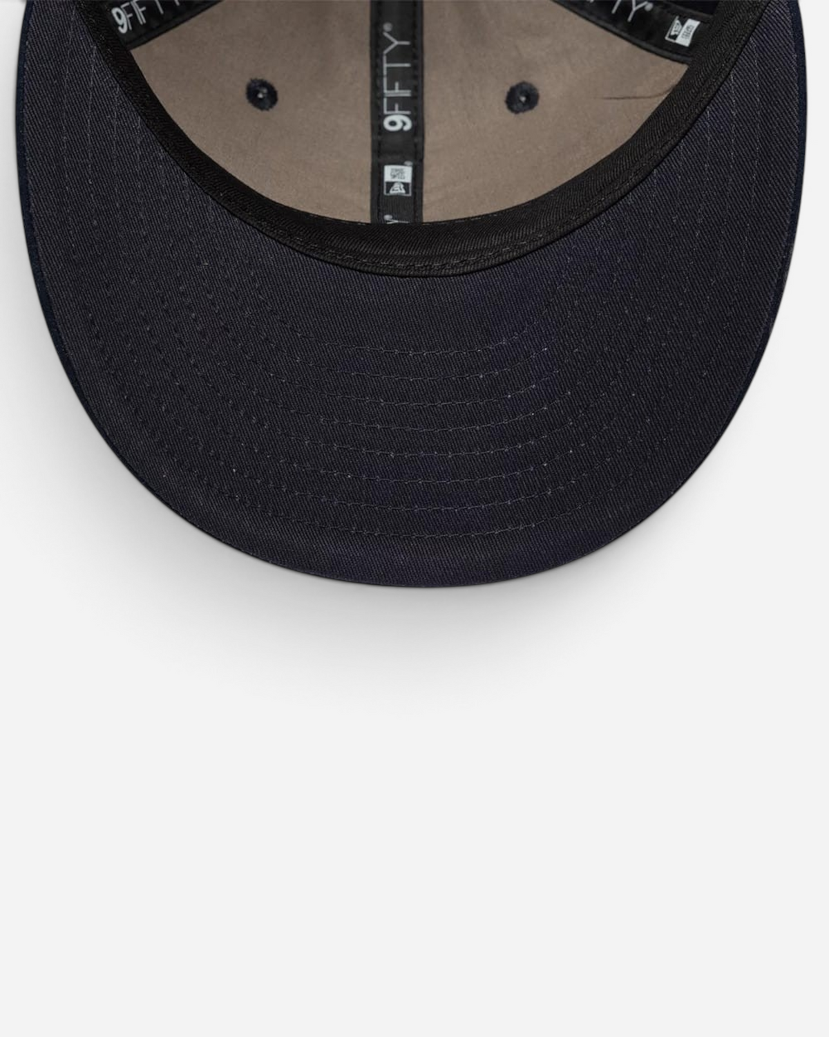 Astrofat 9FIFTY New Era navy blue cap with a flat suede visor and structured interior branding