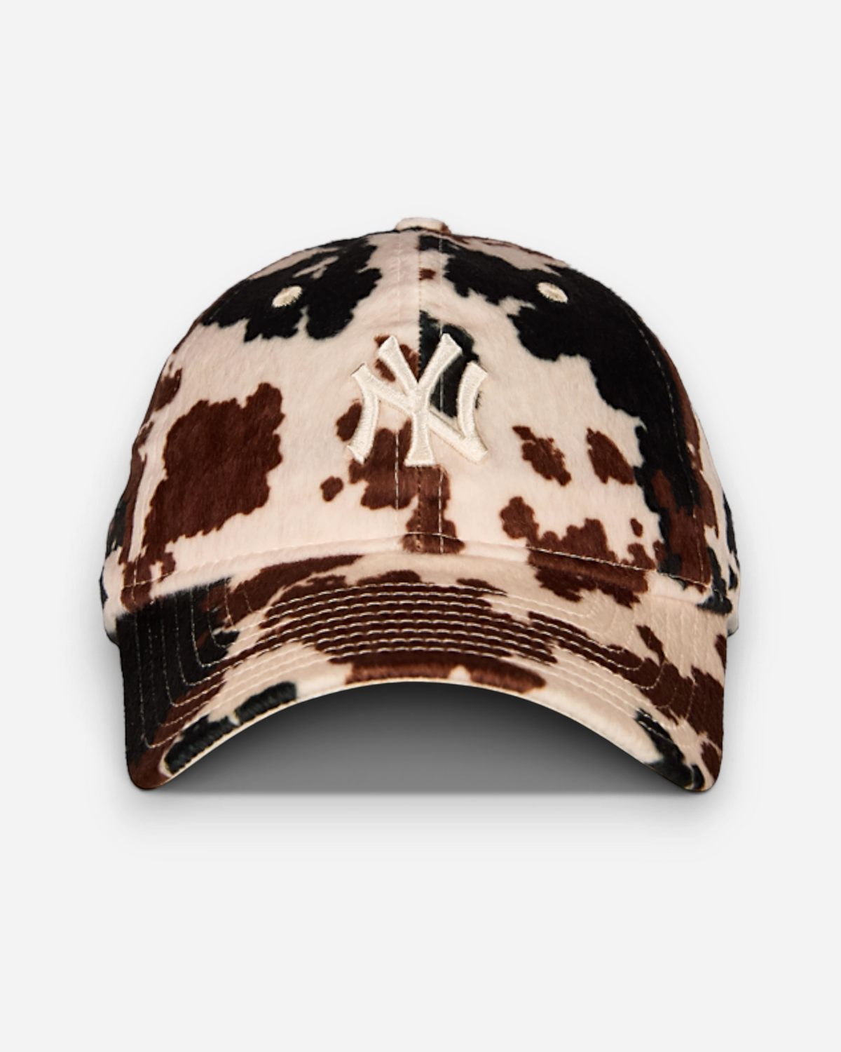 Astrofat 9FORTY New York Yankees cap featuring a brown and white cow print pattern and a curved visor.