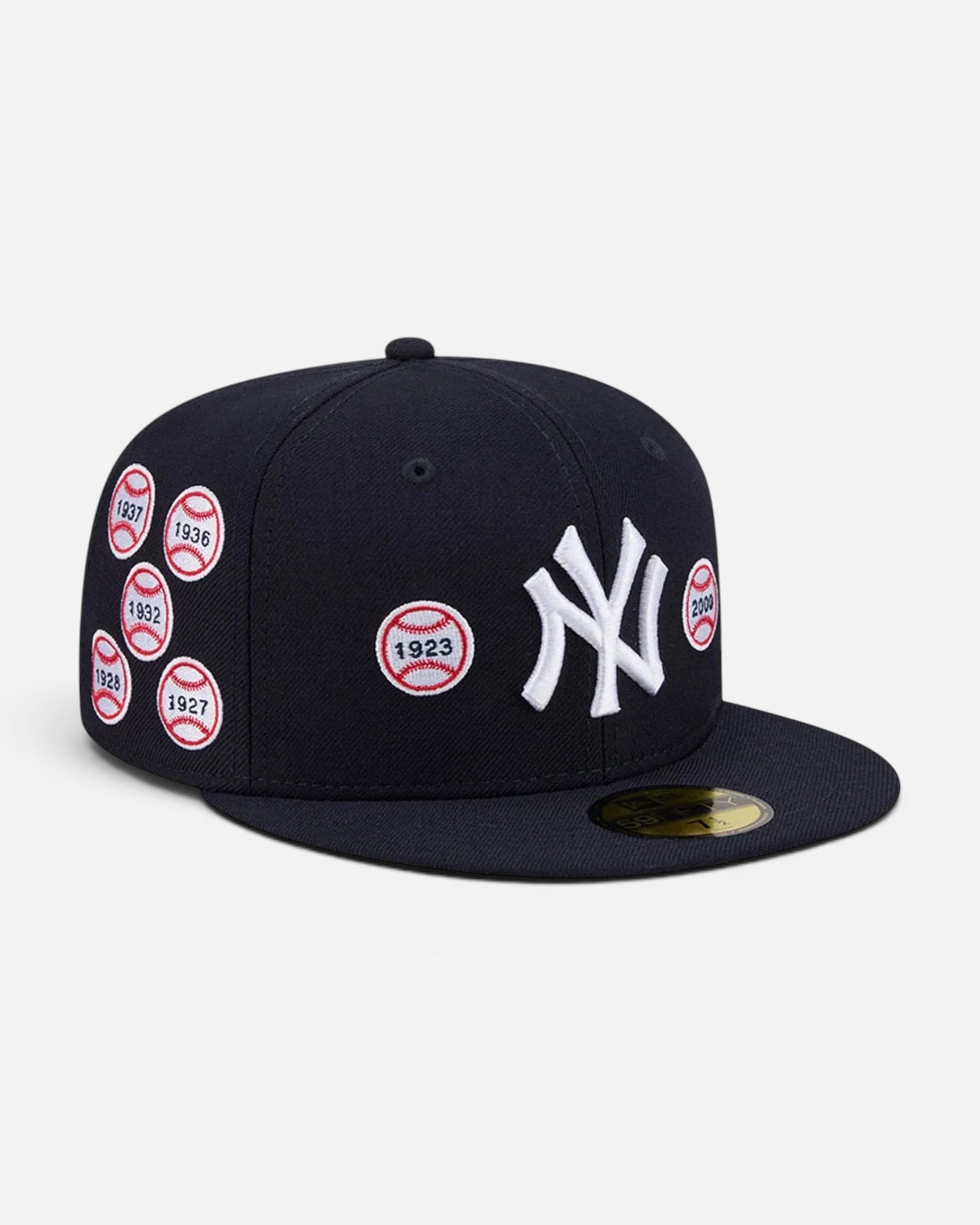 Astrofat navy blue New York Yankees 59FIFTY fitted cap with embroidered World Series patches and flat visor